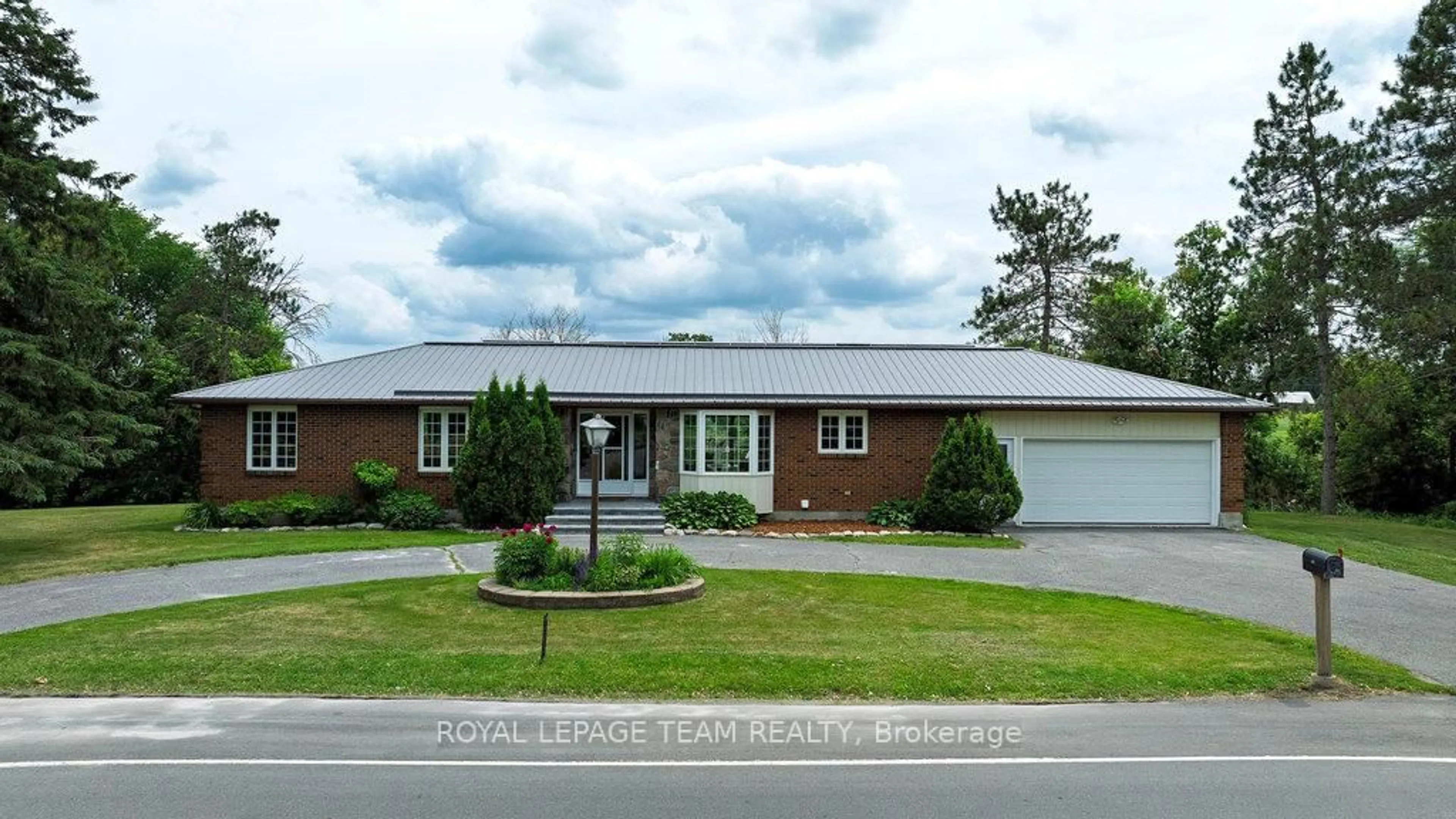 Home with brick exterior material, street for 517 Donald B. Munro Dr, Carp Ontario K0A 1L0