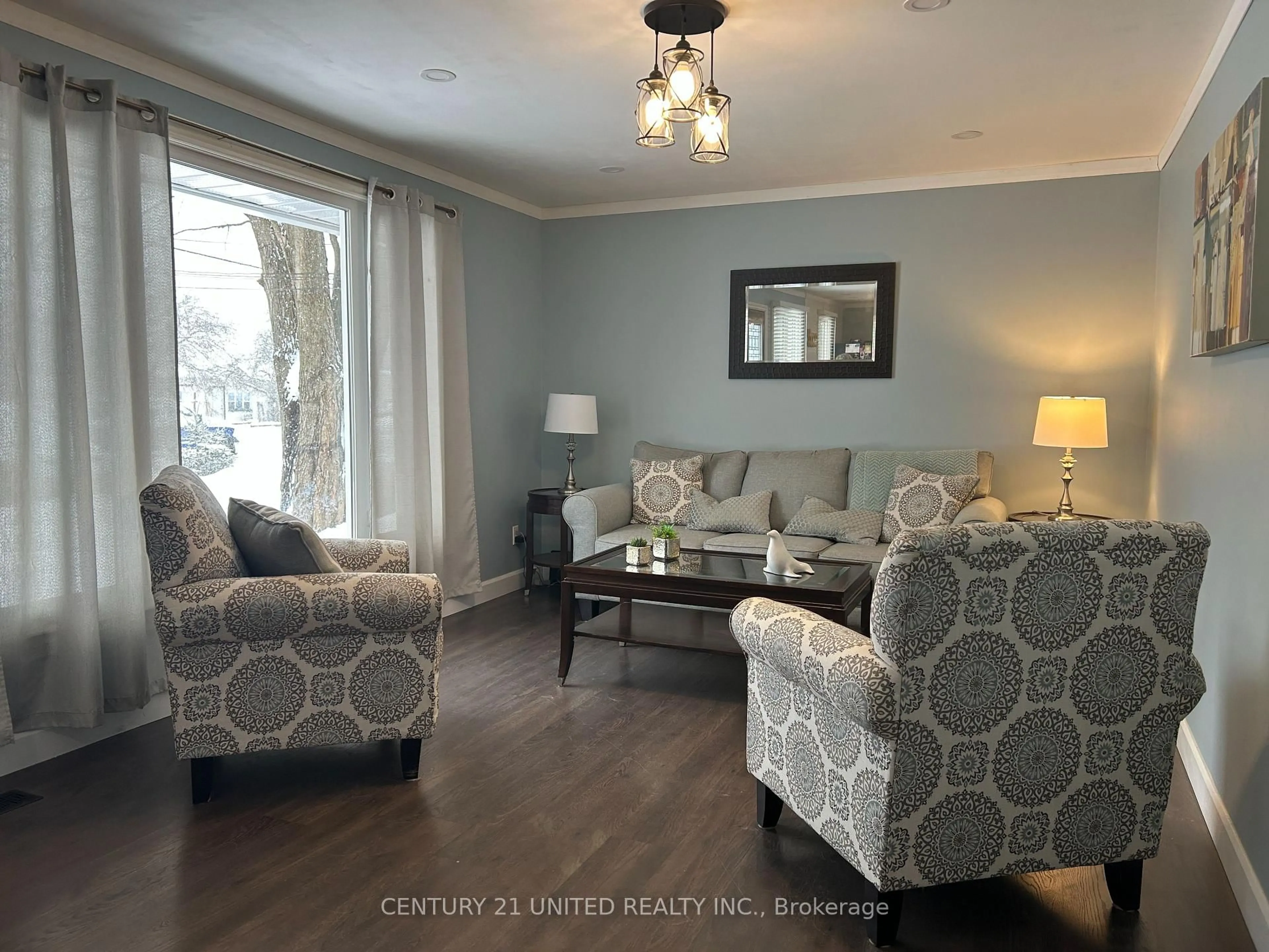 Living room with furniture, wood/laminate floor for 67 Bursthall St, Limoges Ontario K0K 2M0