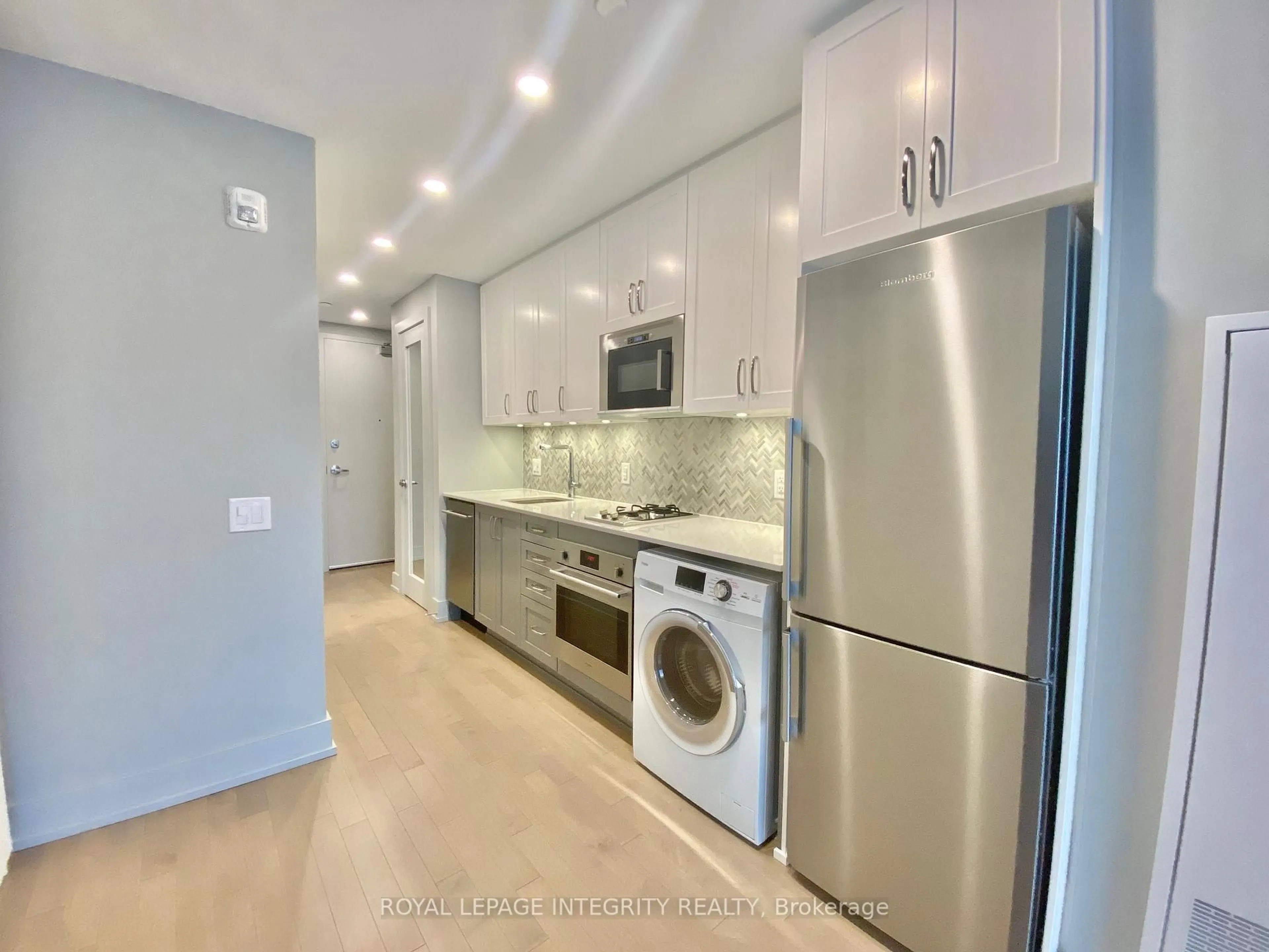 Kitchen with laundary machines, unknown for 60 Springhurst Ave #315, Ottawa Ontario K1S 5V7