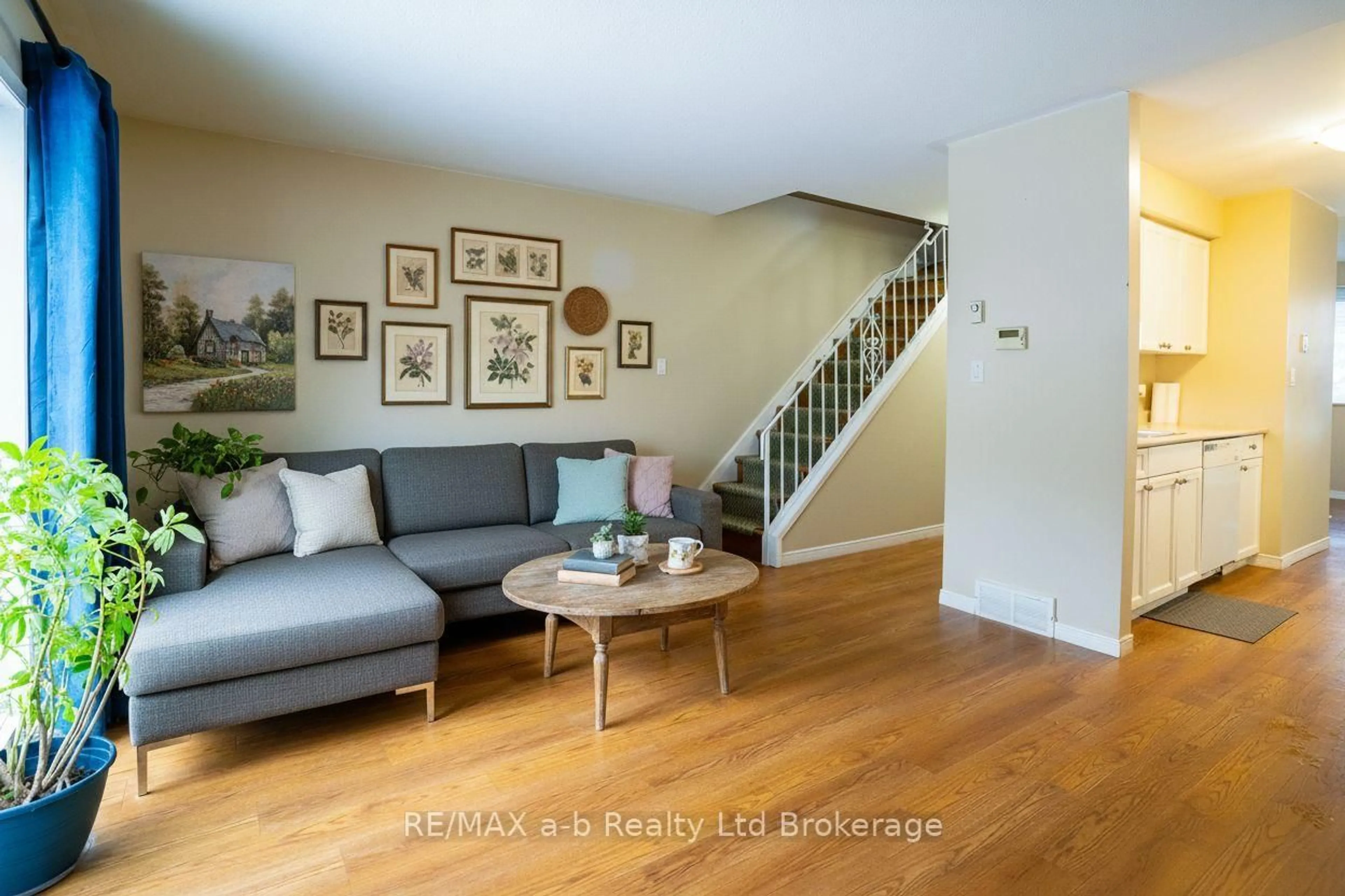 Living room with furniture, wood/laminate floor for 10 Dufferin St #1, Norwich Ontario N0J 1P0