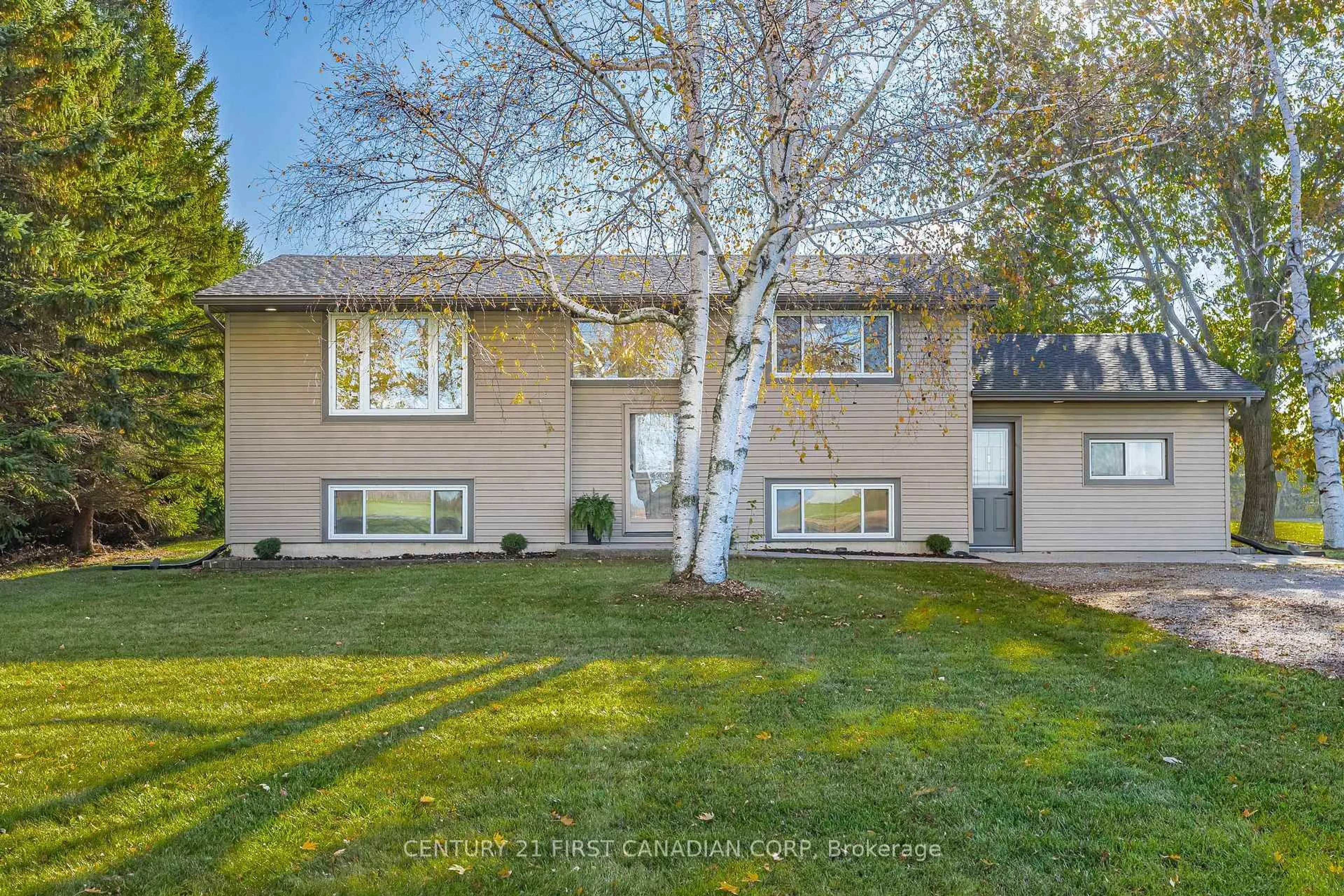 Home with vinyl exterior material, street for 70986 B Line, South Huron Ontario N0M 1T0