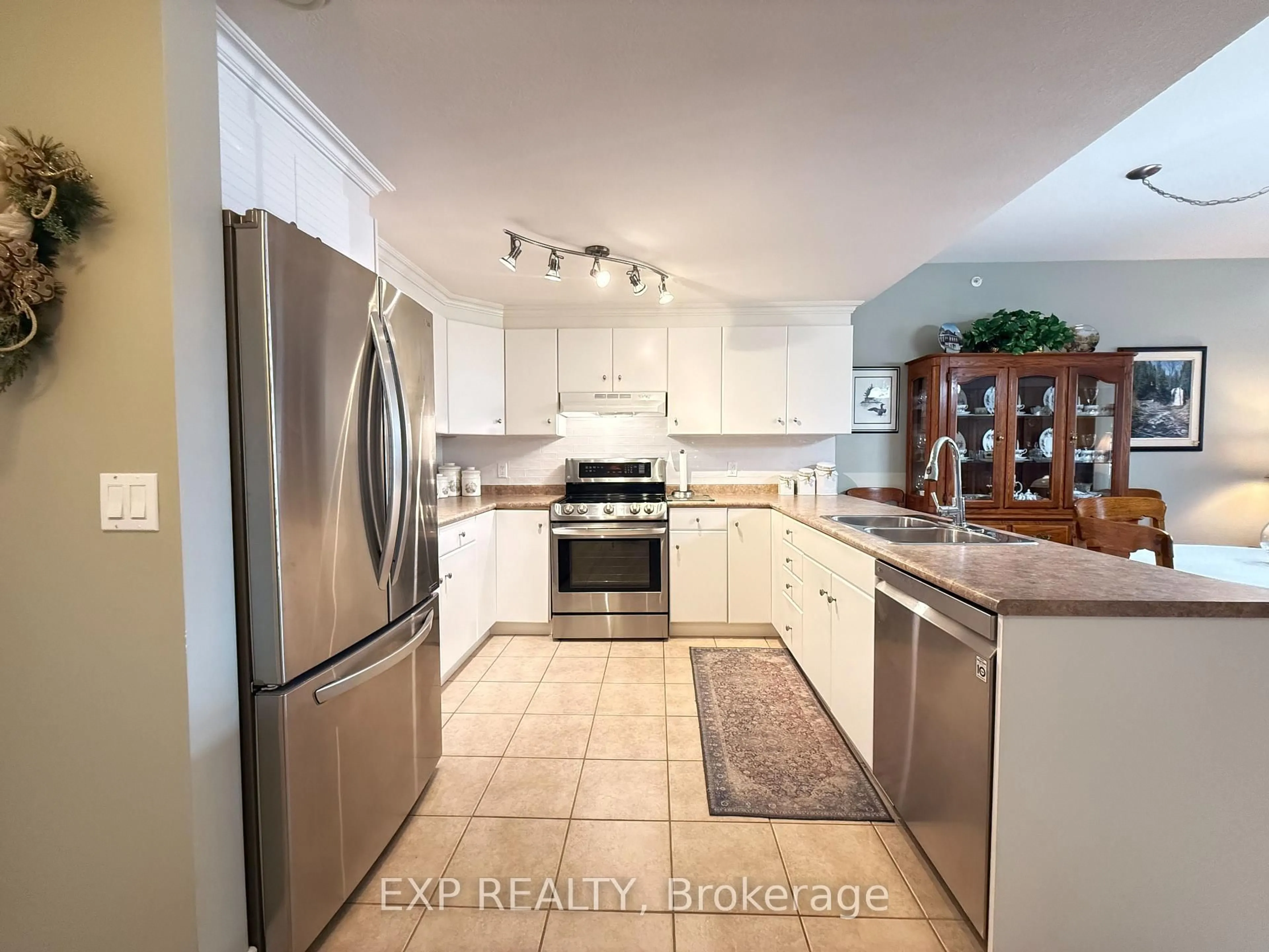 Open concept kitchen, ceramic/tile floor for 20 Station Sq #103, Centre Wellington Ontario N0B 1S0