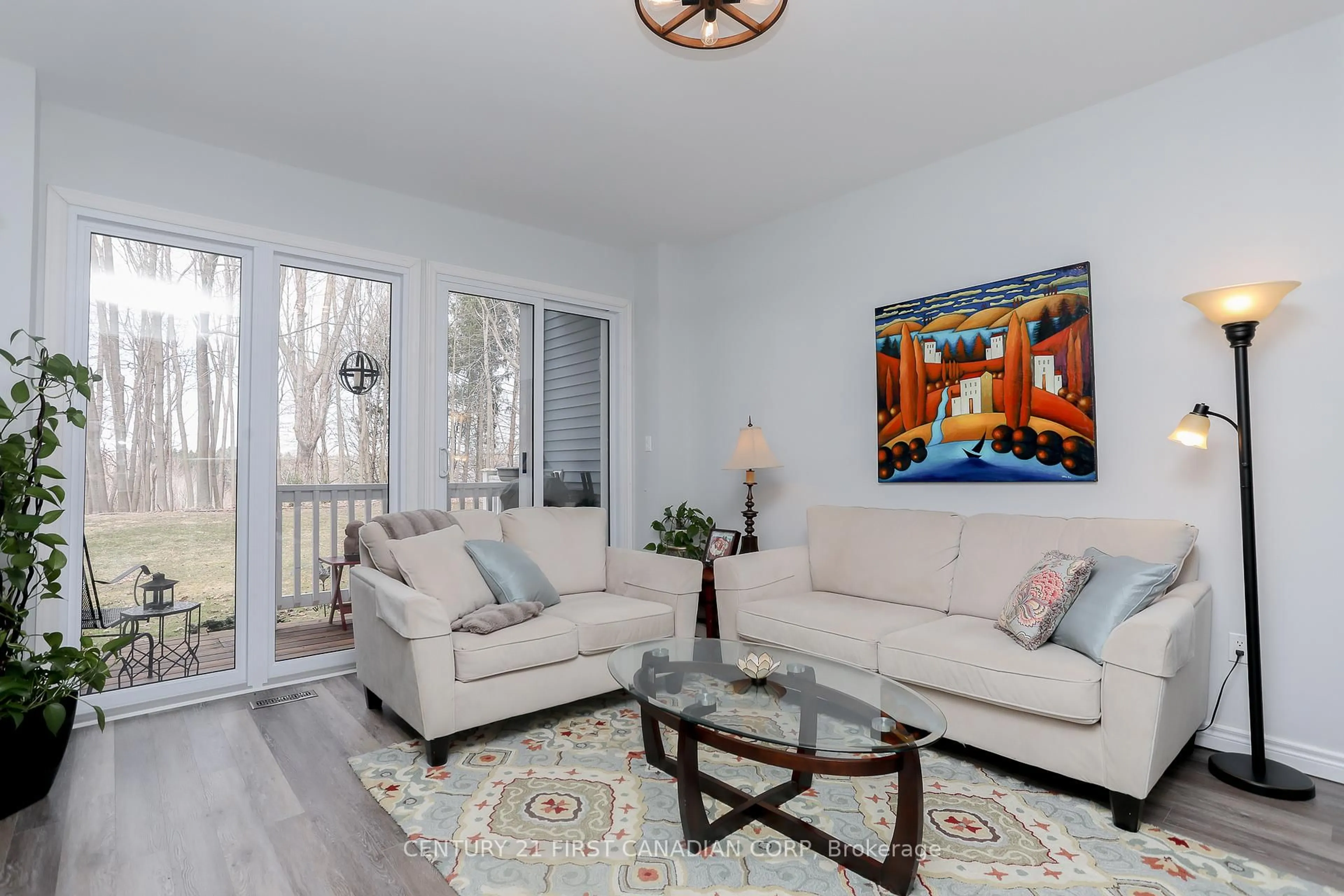 Living room with furniture, wood/laminate floor for 374 Front St #10, Central Elgin Ontario N5L 1E9