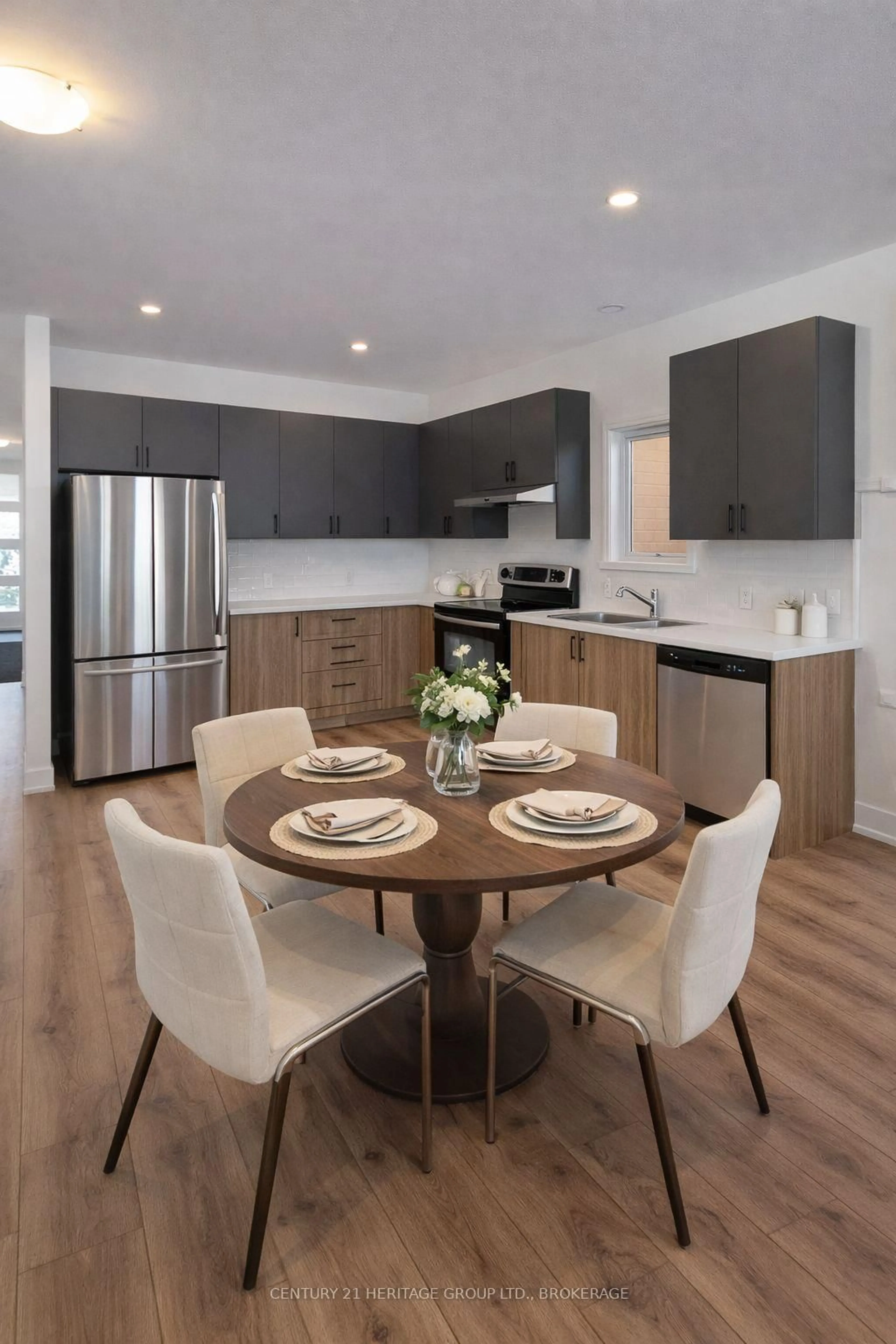 Open concept kitchen, wood/laminate floor for 105 Creighton(lot 63) Dr, Newburgh Ontario K0K 2S0