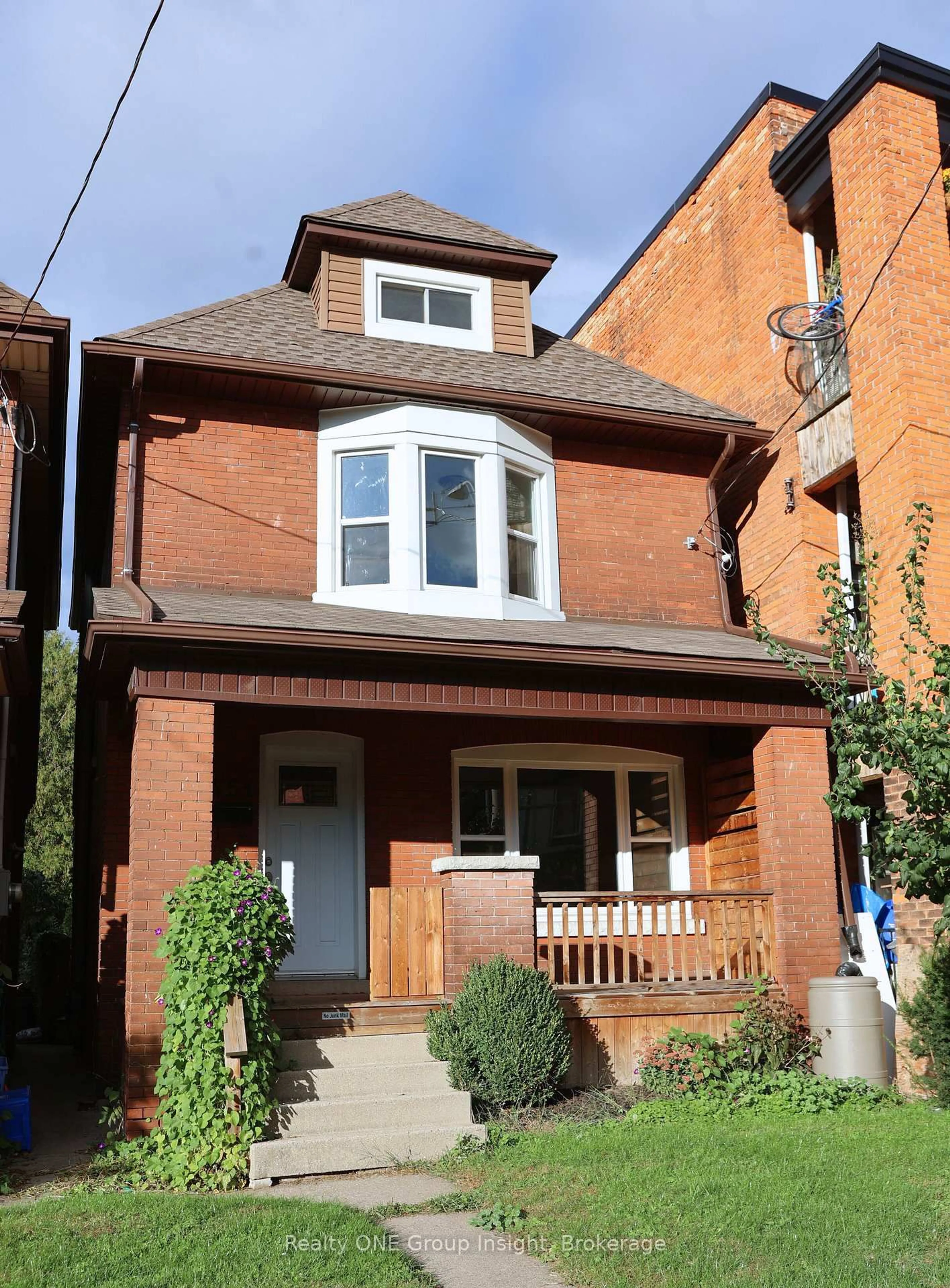 Home with brick exterior material, street for 451 King William St, Hamilton Ontario L8L 1R1