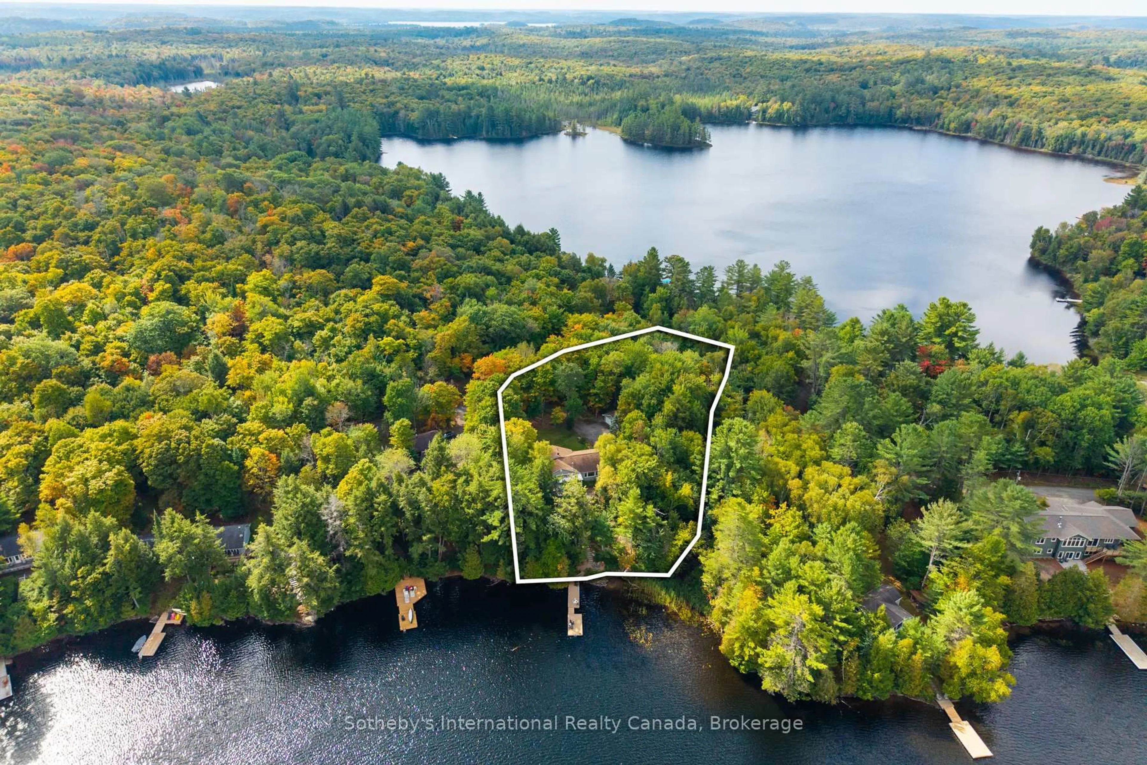 A pic from outside/outdoor area/front of a property/back of a property/a pic from drone, water/lake/river/ocean view for 20 Fish Rock Rd, Huntsville Ontario P1H 2N5
