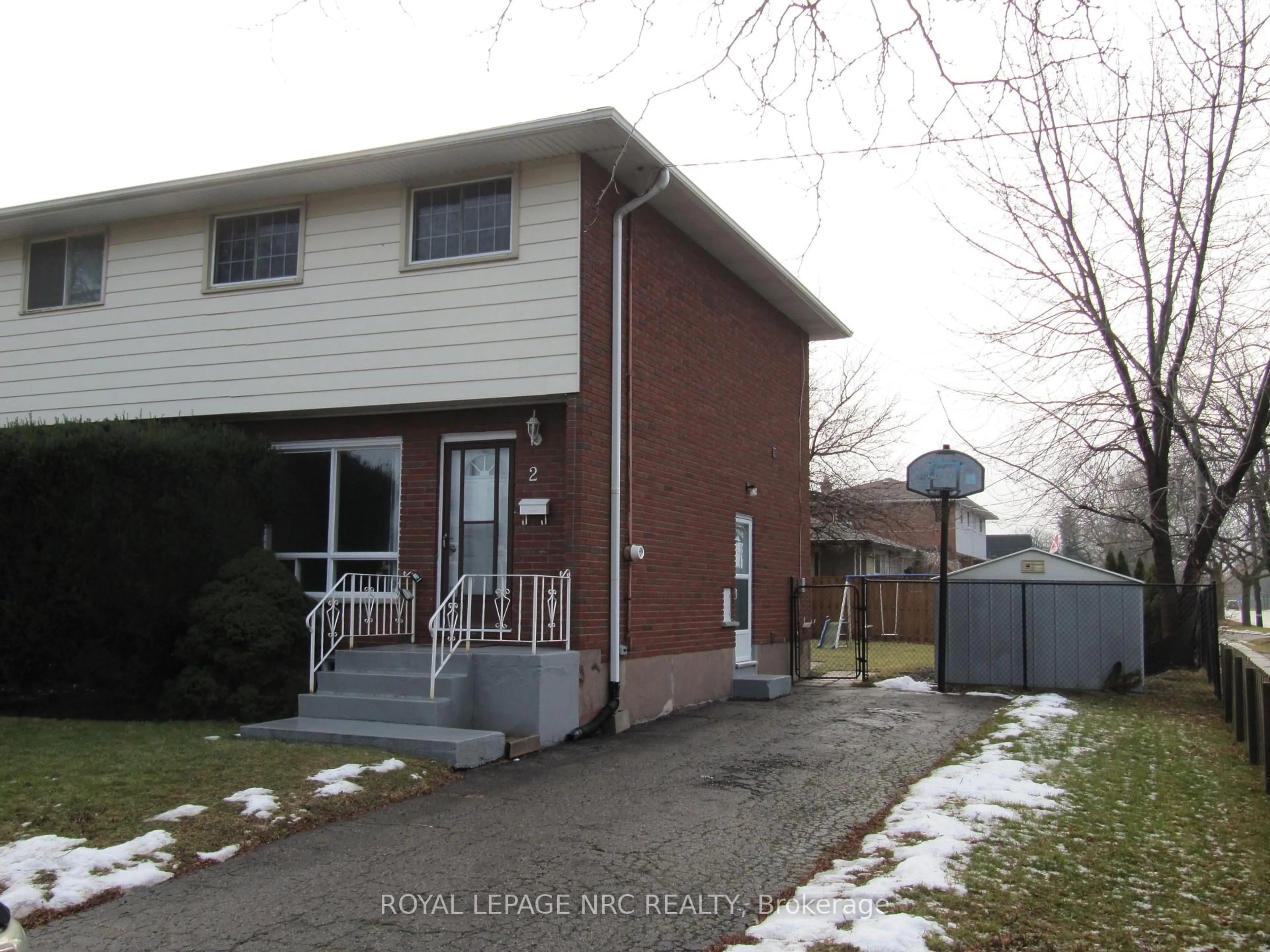 Home with brick exterior material, street for 2 Black Knight Rd, St. Catharines Ontario L2N 3C1