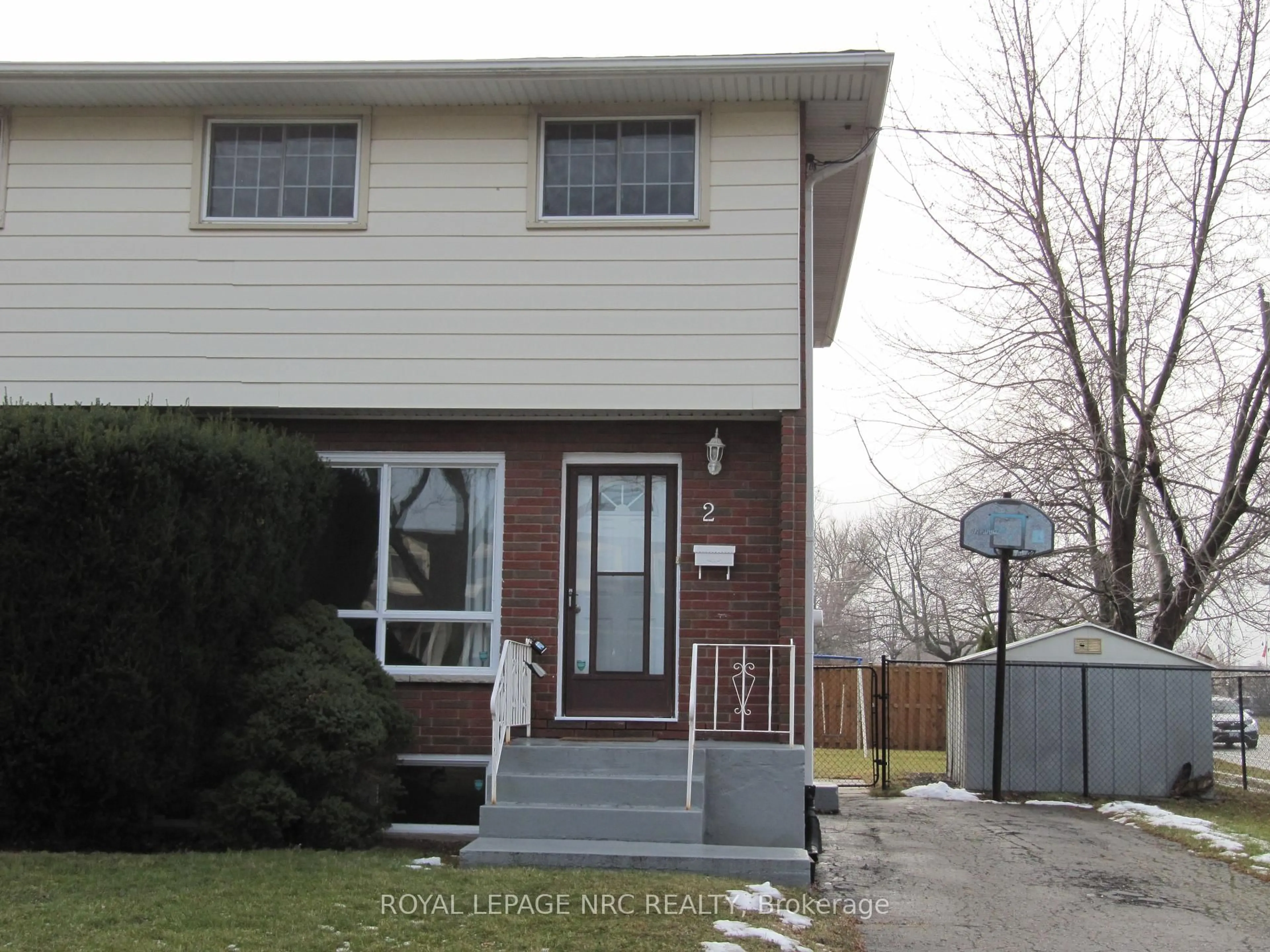 Home with vinyl exterior material, street for 2 Black Knight Rd, St. Catharines Ontario L2N 3C1