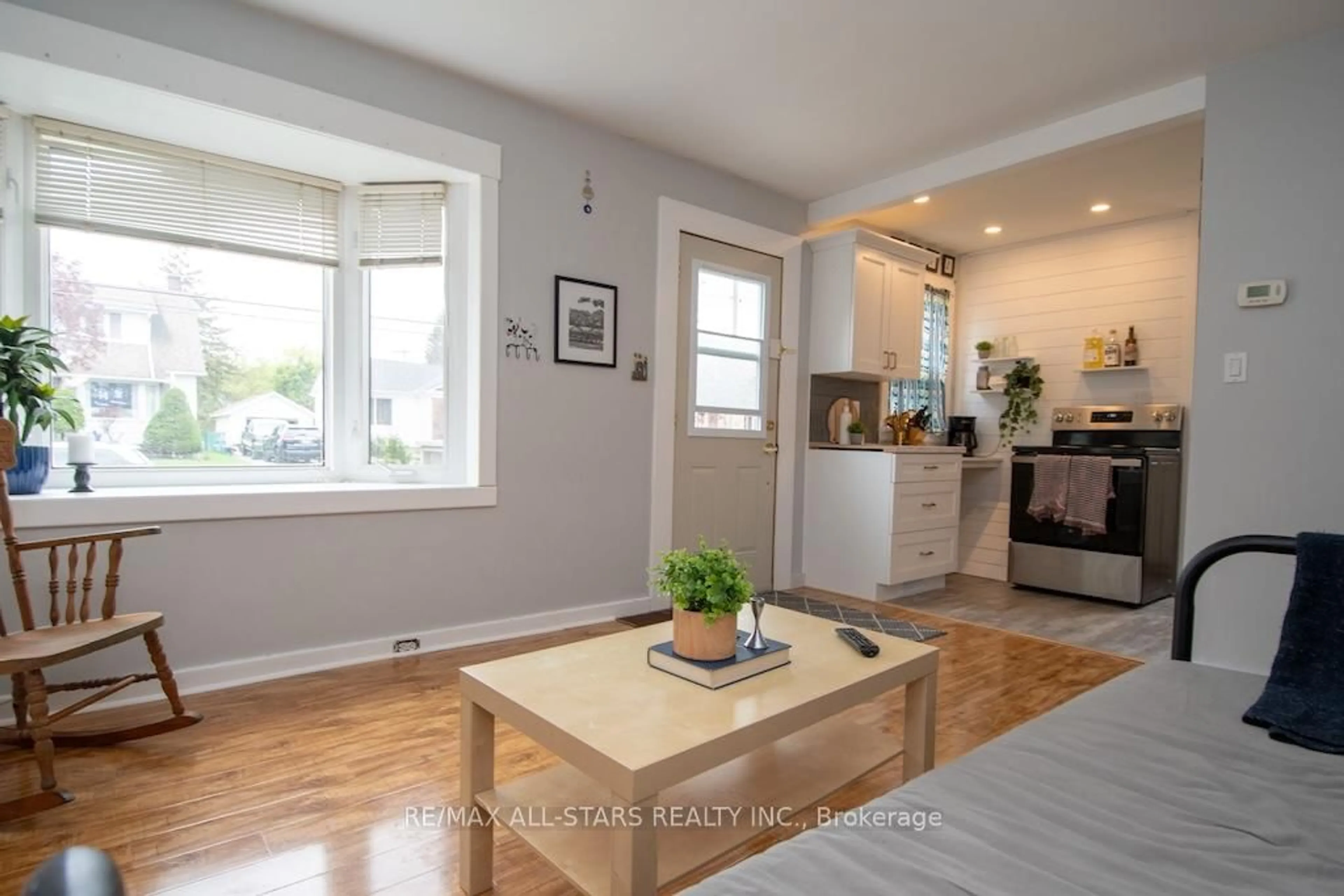 Living room with furniture, wood/laminate floor for 32 Adelaide St, Kawartha Lakes Ontario K9V 3J7