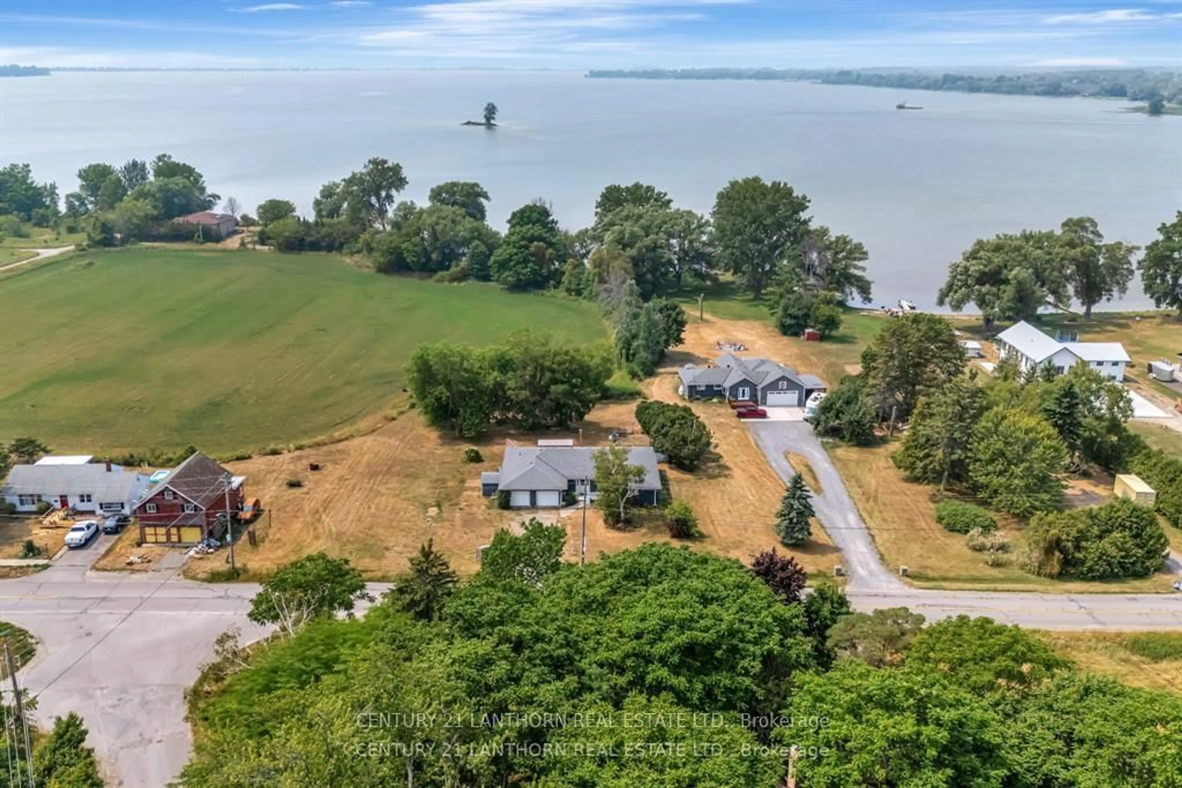 A pic from outside/outdoor area/front of a property/back of a property/a pic from drone, water/lake/river/ocean view for 263 County Rd 29 Rd, Prince Edward County Ontario K0K 1T0