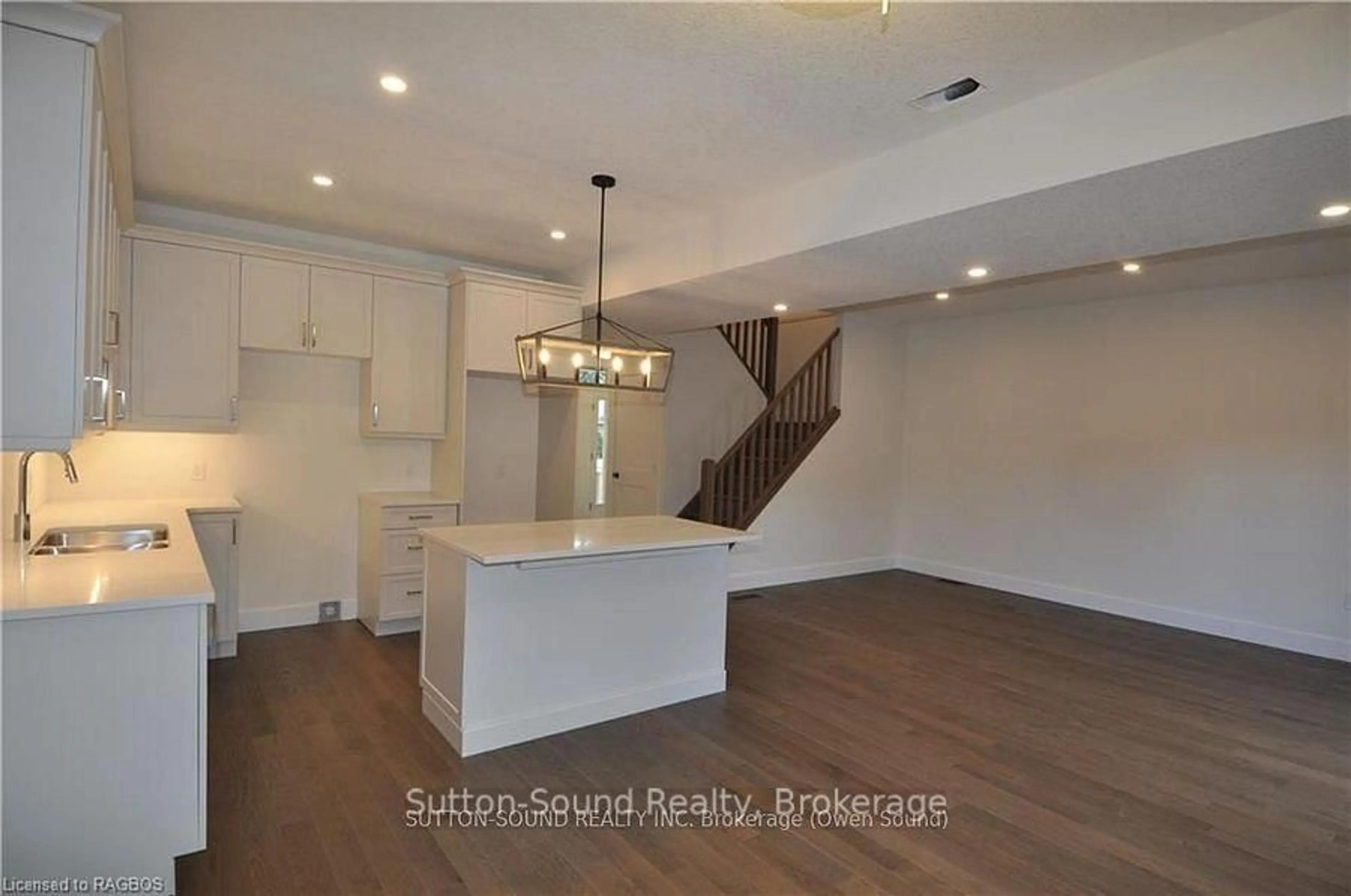 Open concept kitchen, wood/laminate floor for 642 8th St, Owen Sound Ontario N4K 5N3