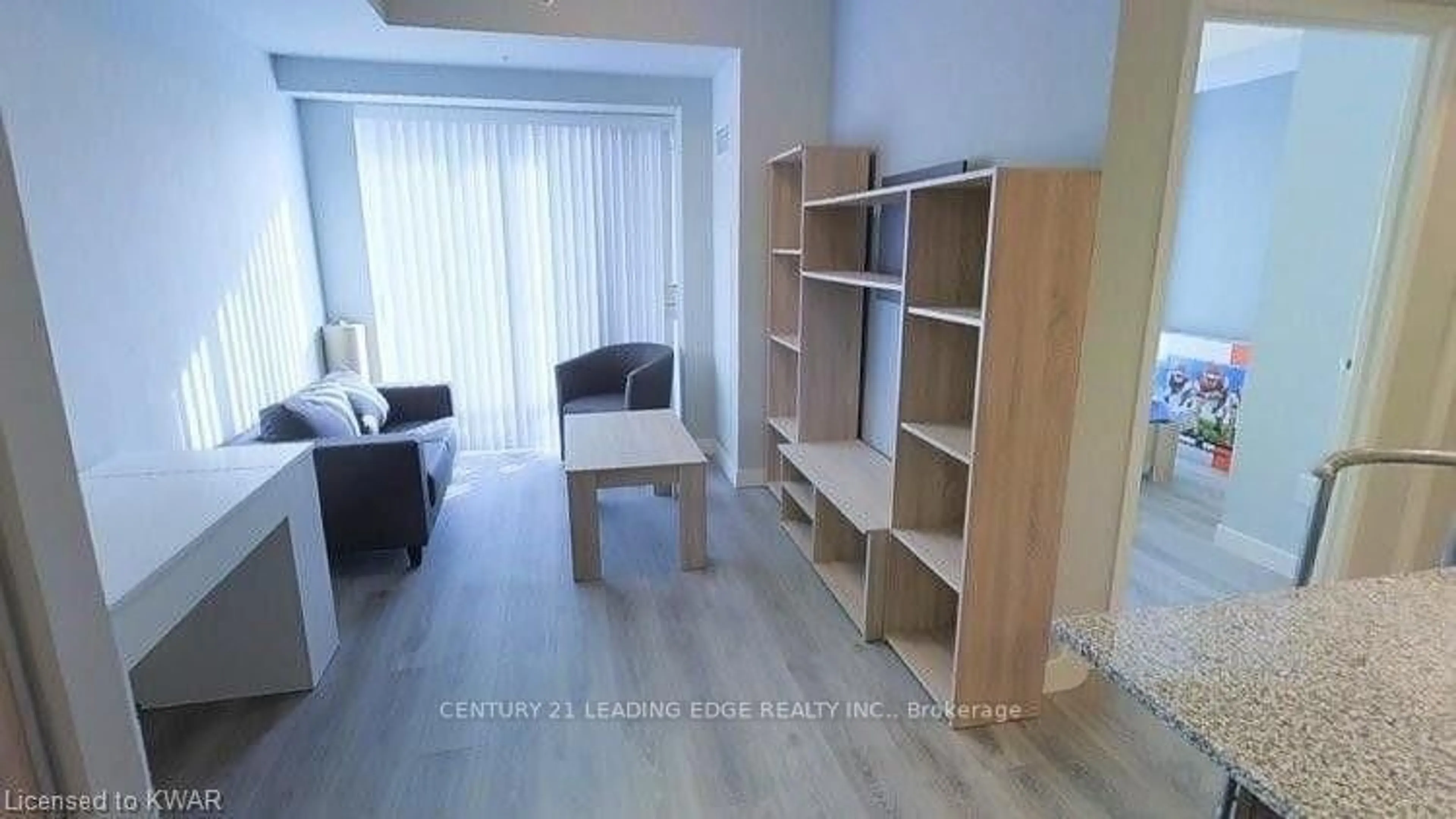 Living room with furniture, wood/laminate floor for 318 Spruce St #910, Waterloo Ontario N2L 0E9
