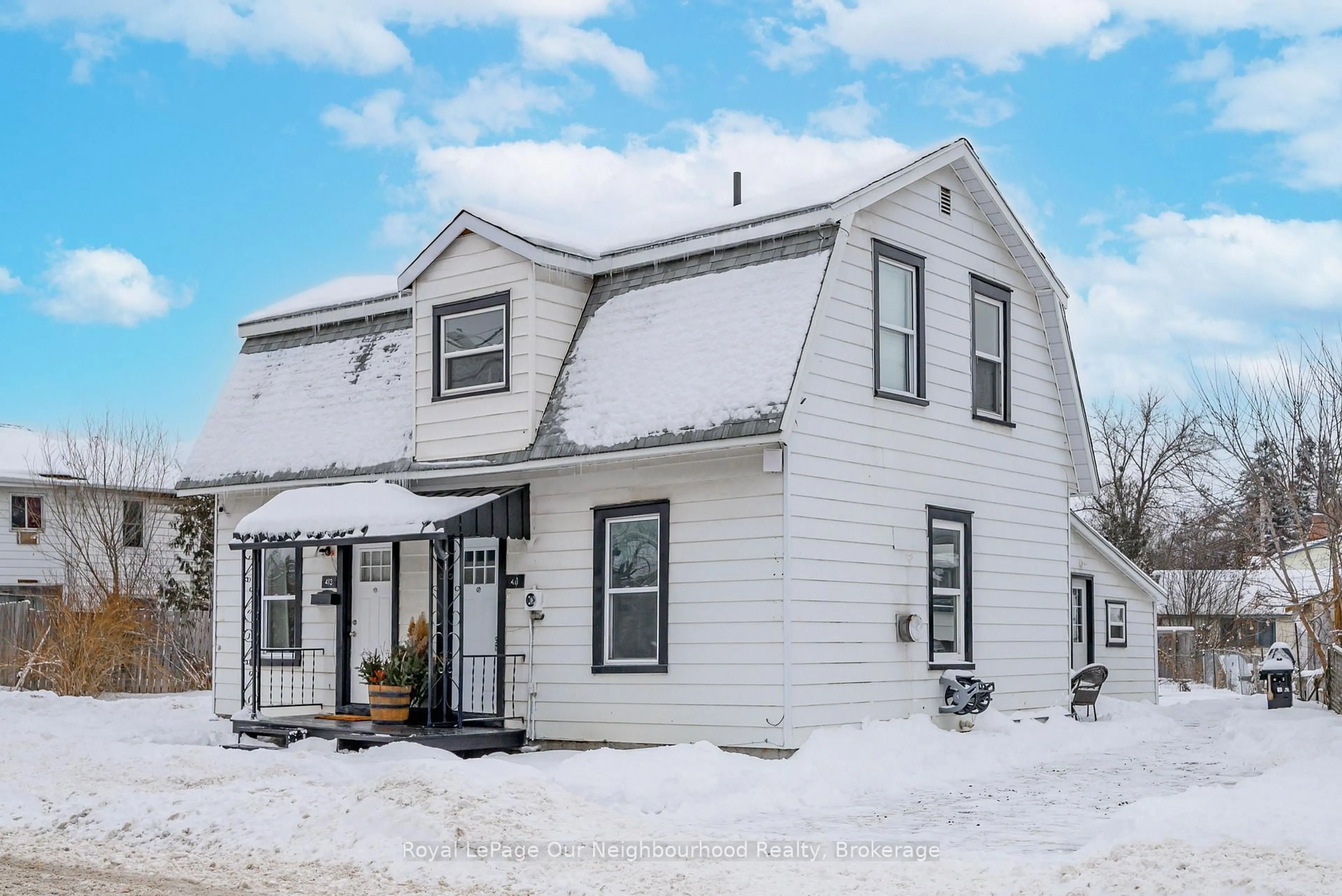 Home with vinyl exterior material, street for 411 Moira St, Tweed Ontario K0K 3J0