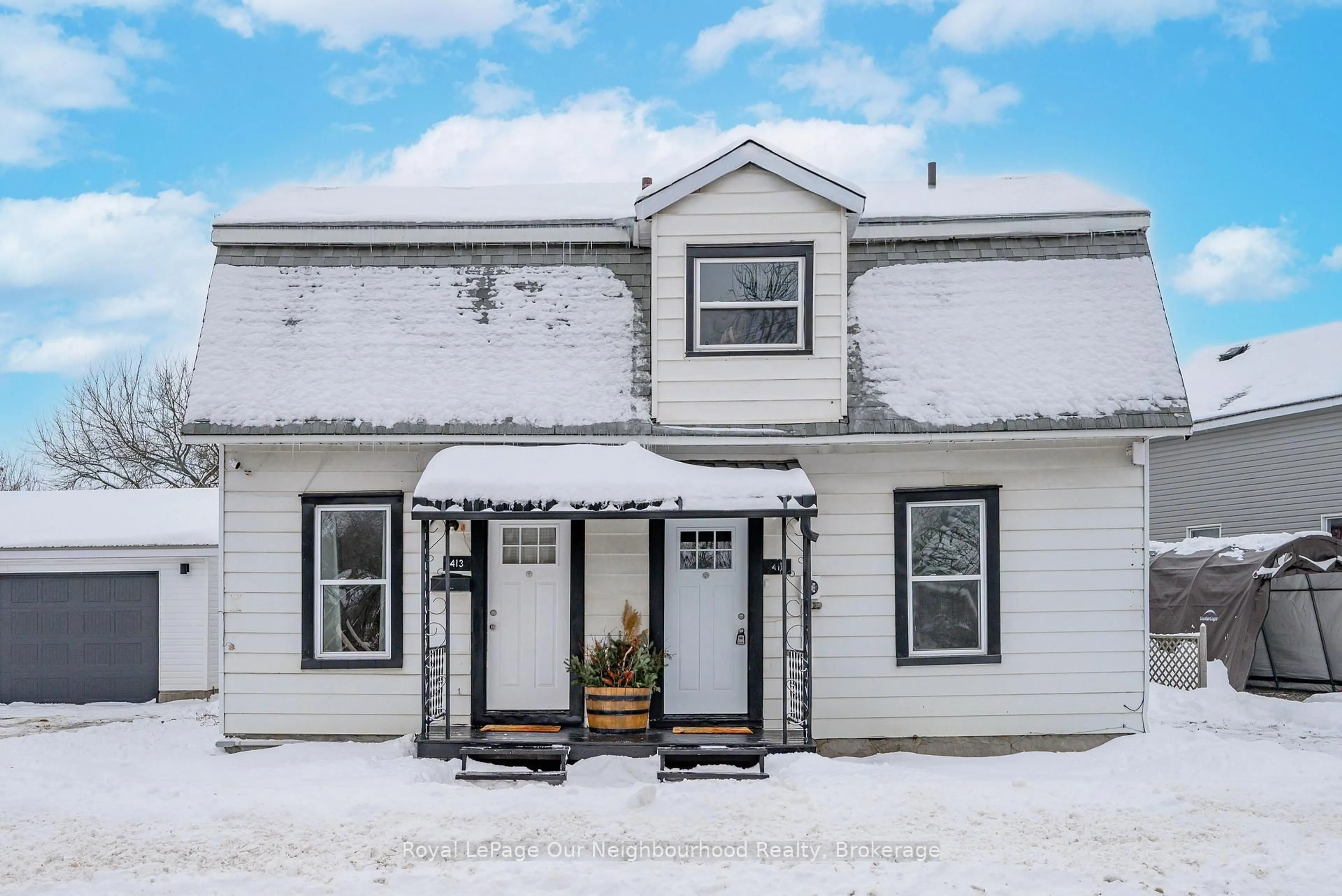 Home with vinyl exterior material, street for 411 Moira St, Tweed Ontario K0K 3J0