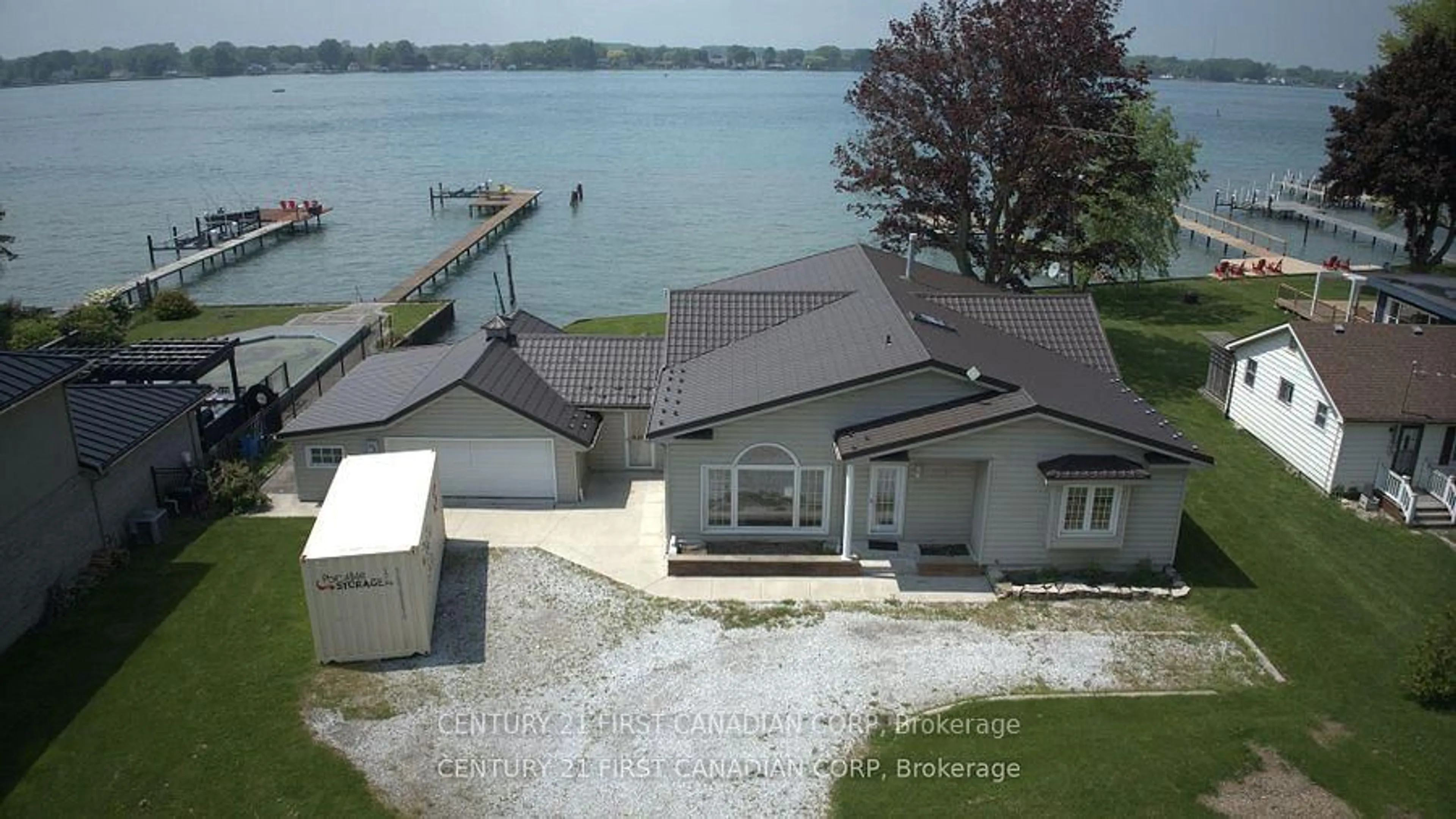 A pic from outside/outdoor area/front of a property/back of a property/a pic from drone, water/lake/river/ocean view for 3877 St Clair Pkwy, St. Clair Ontario N0P 2B0
