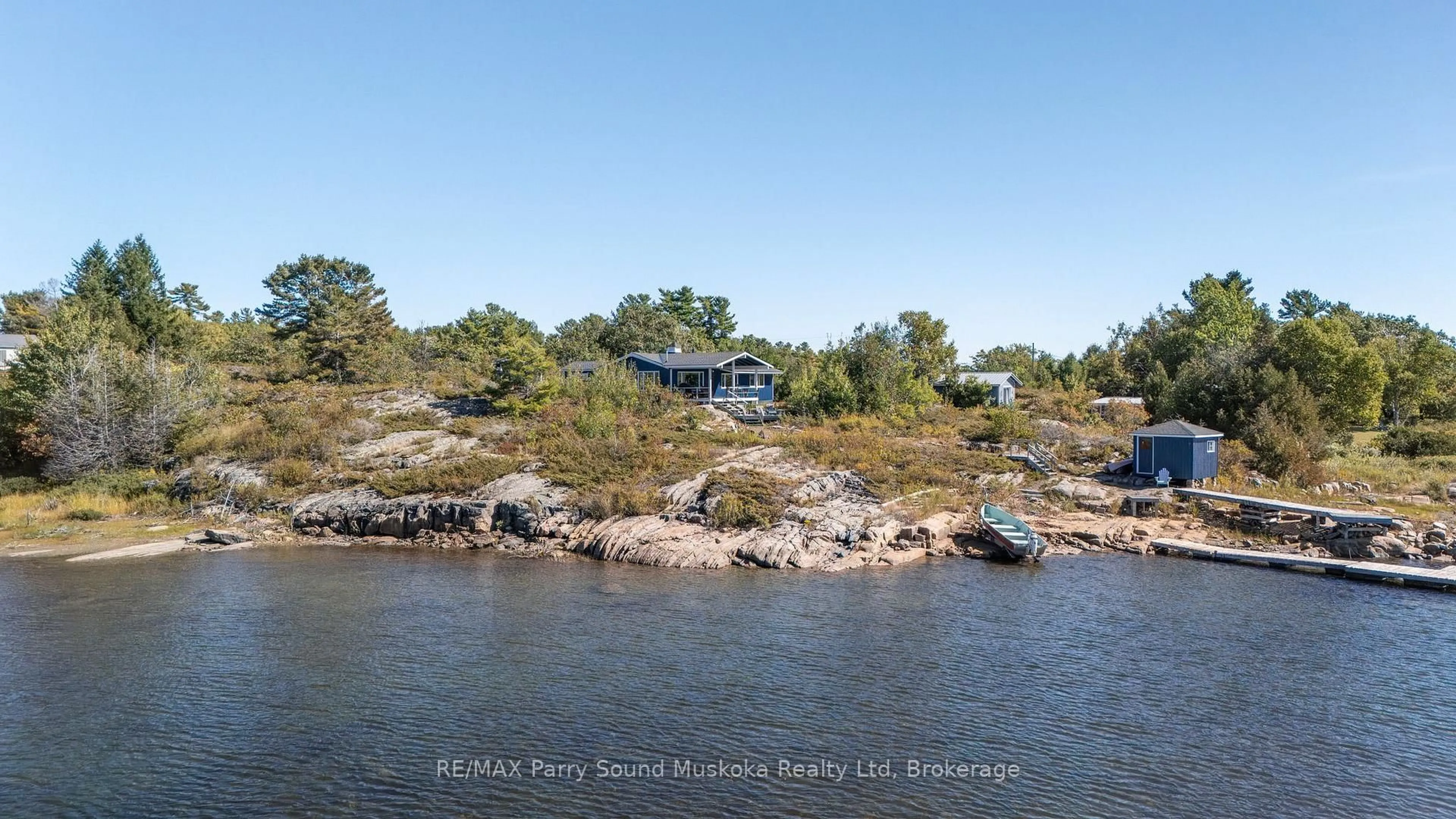 A pic from outside/outdoor area/front of a property/back of a property/a pic from drone, water/lake/river/ocean view for 15 Forsyths Rd, Carling Ontario P0G 1G0
