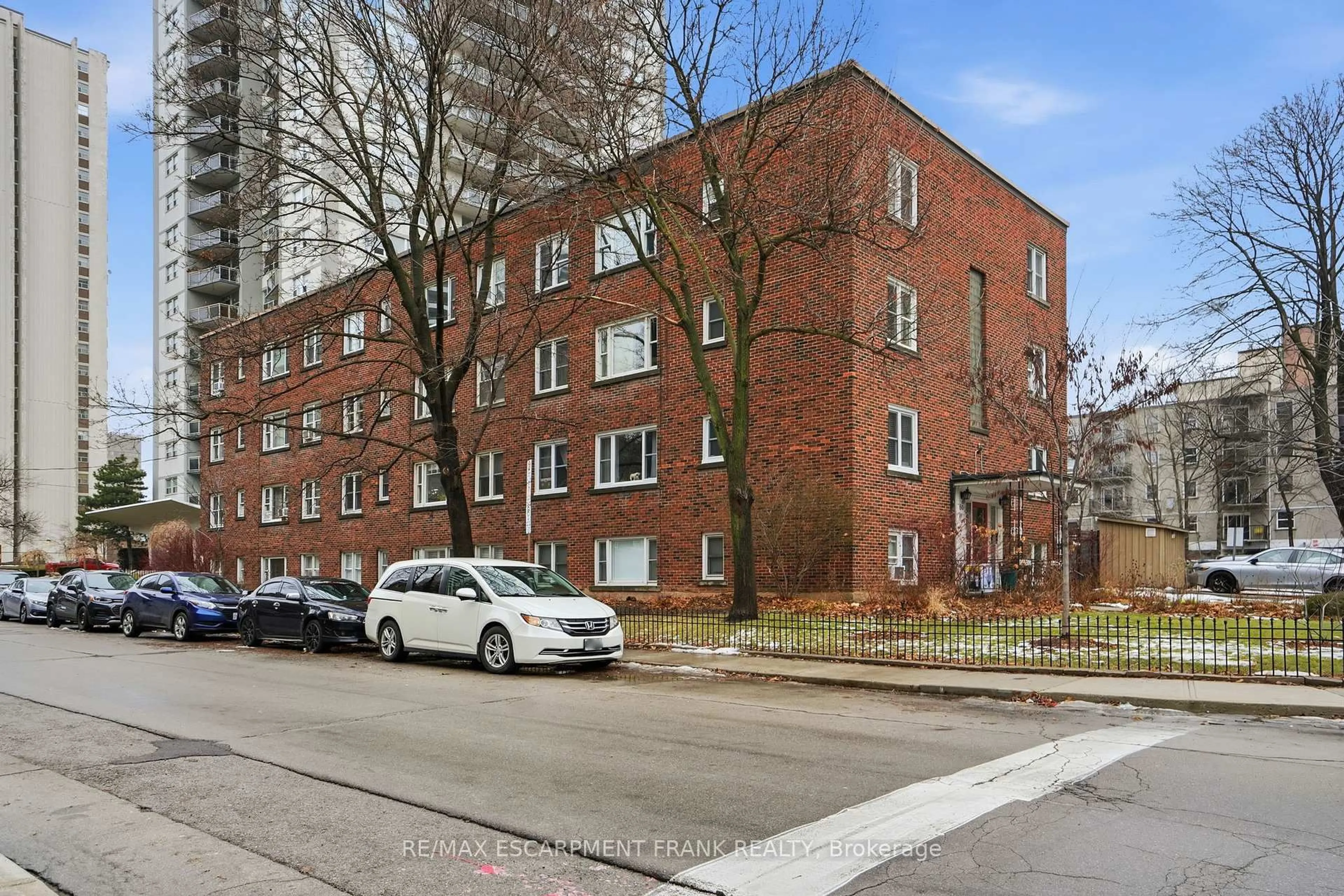 Home with brick exterior material, street for 60 ROBINSON St #104, Hamilton Ontario L8P 1Y9