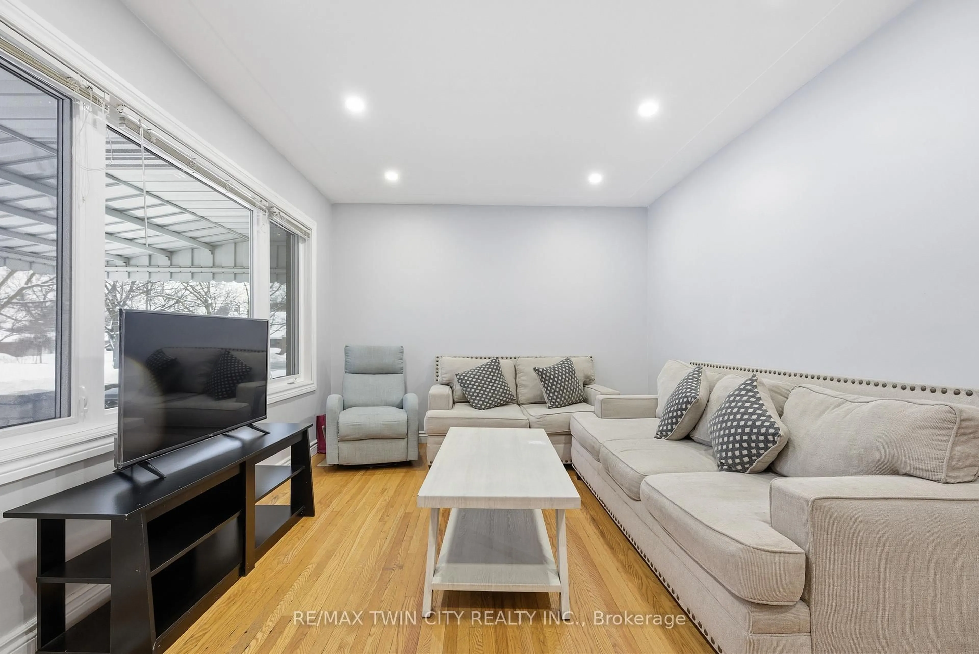 Living room with furniture, wood/laminate floor for 18 Harber Ave, Kitchener Ontario N2C 1Y8