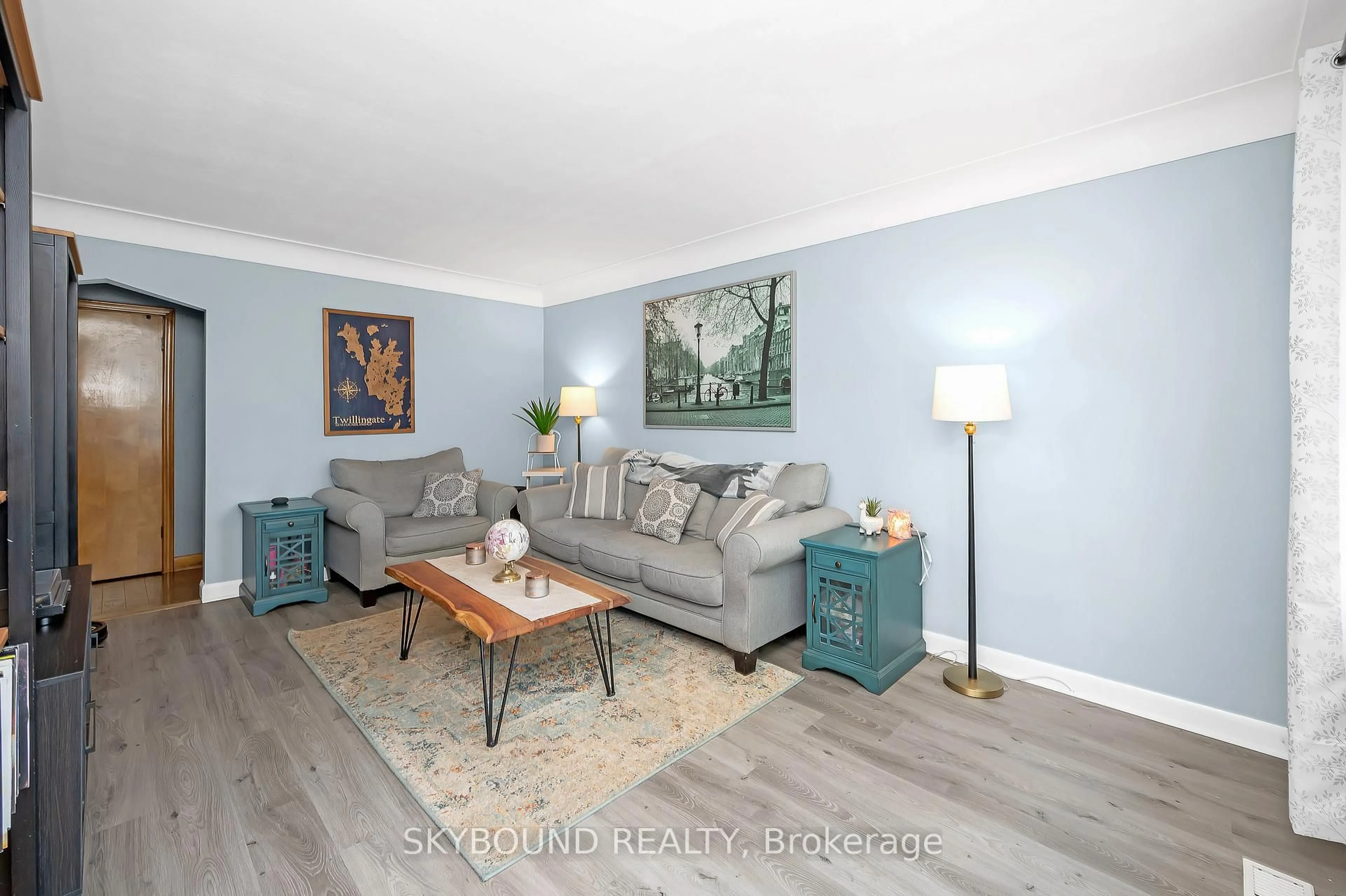 Living room with furniture, wood/laminate floor for 103 McElroy Rd, Hamilton Ontario L9A 1Y7