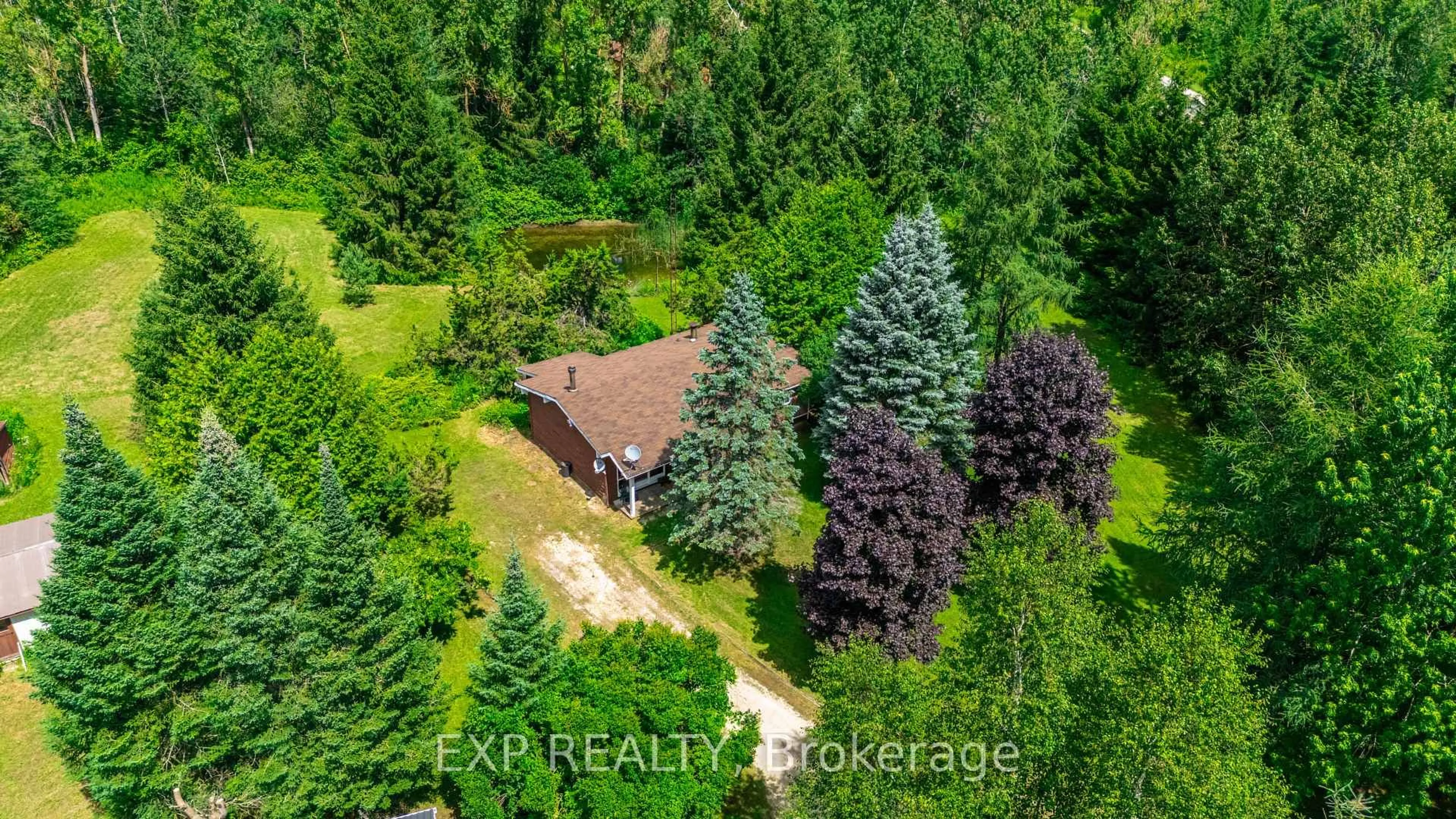A pic from outside/outdoor area/front of a property/back of a property/a pic from drone, forest/trees view for 111490 Grey County Road 14, Southgate Ontario N0G 1N0