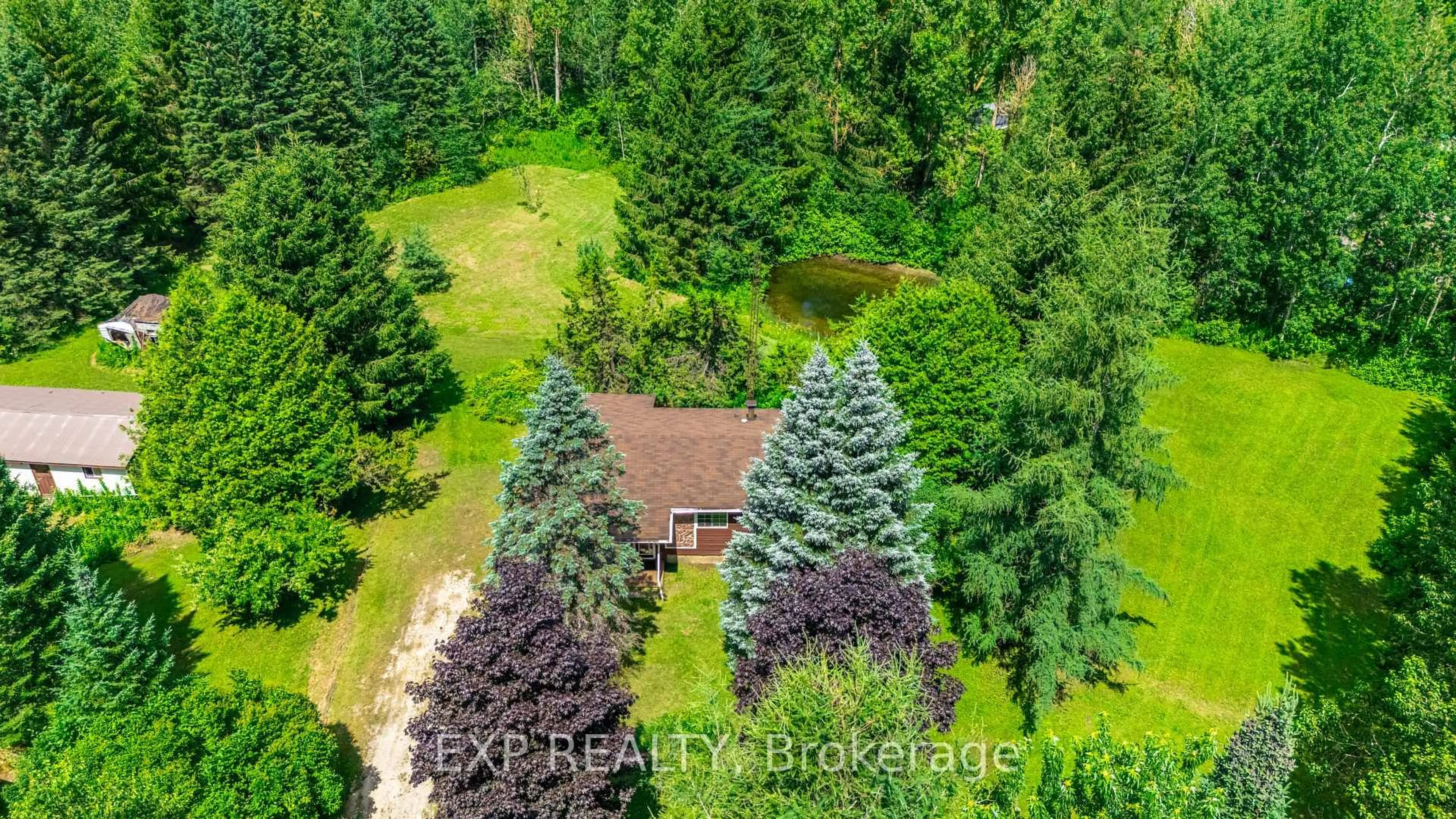 A pic from outside/outdoor area/front of a property/back of a property/a pic from drone, forest/trees view for 111490 Grey County Road 14, Southgate Ontario N0G 1N0