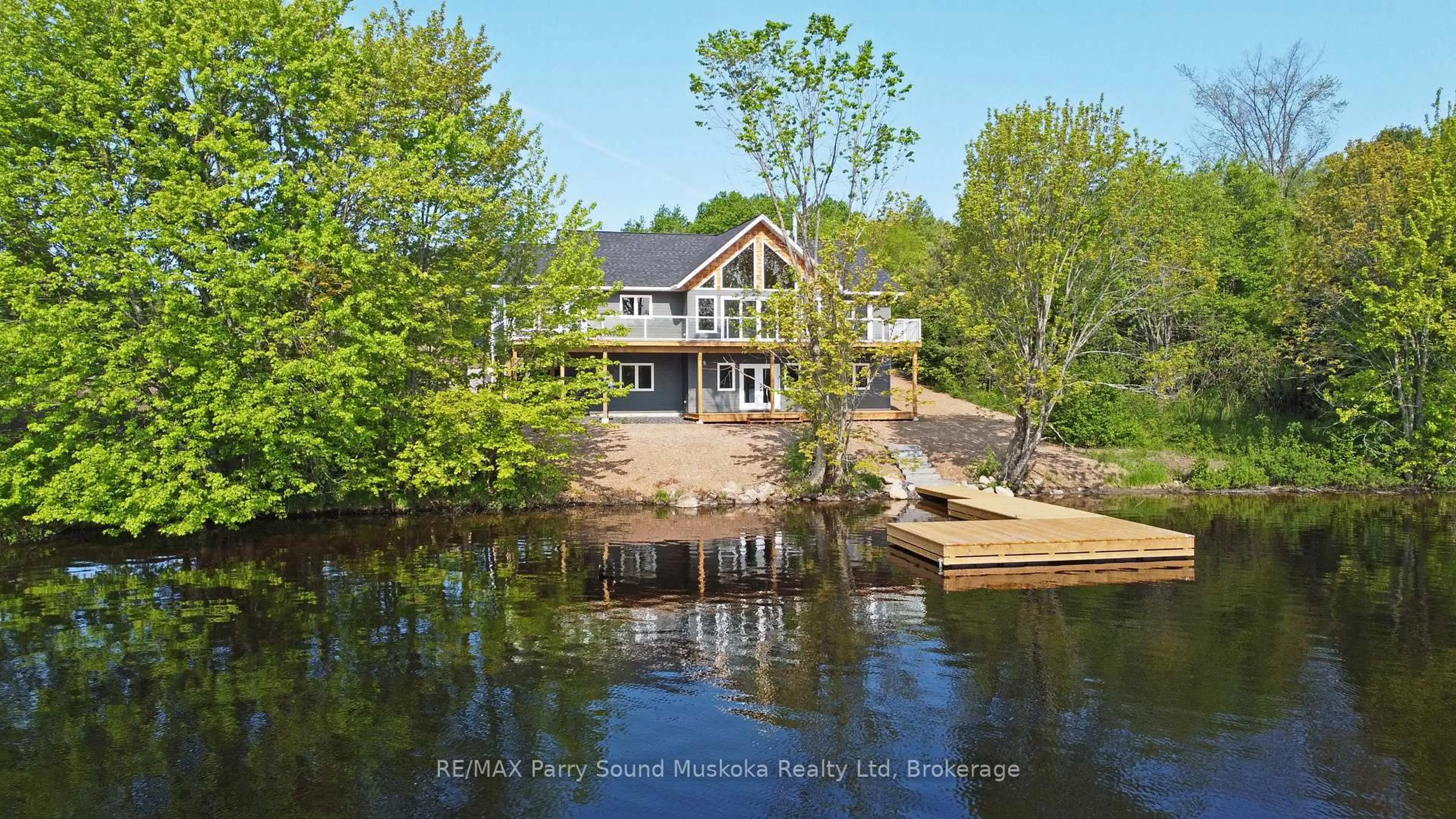 A pic from outside/outdoor area/front of a property/back of a property/a pic from drone, water/lake/river/ocean view for 49 Hardies Rd, McKellar Ontario P2A 0B5