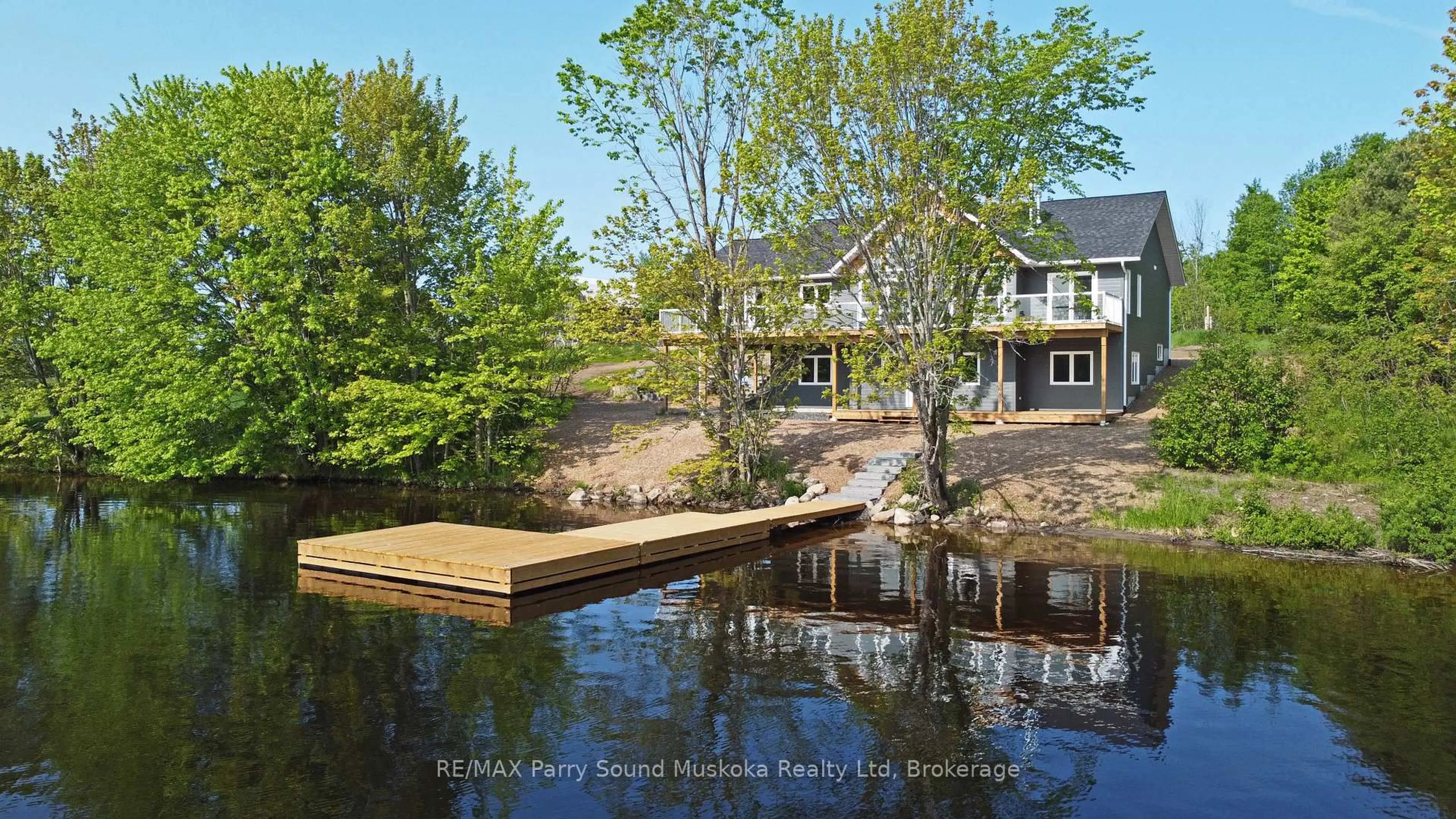 A pic from outside/outdoor area/front of a property/back of a property/a pic from drone, water/lake/river/ocean view for 49 Hardies Rd, McKellar Ontario P2A 0B5