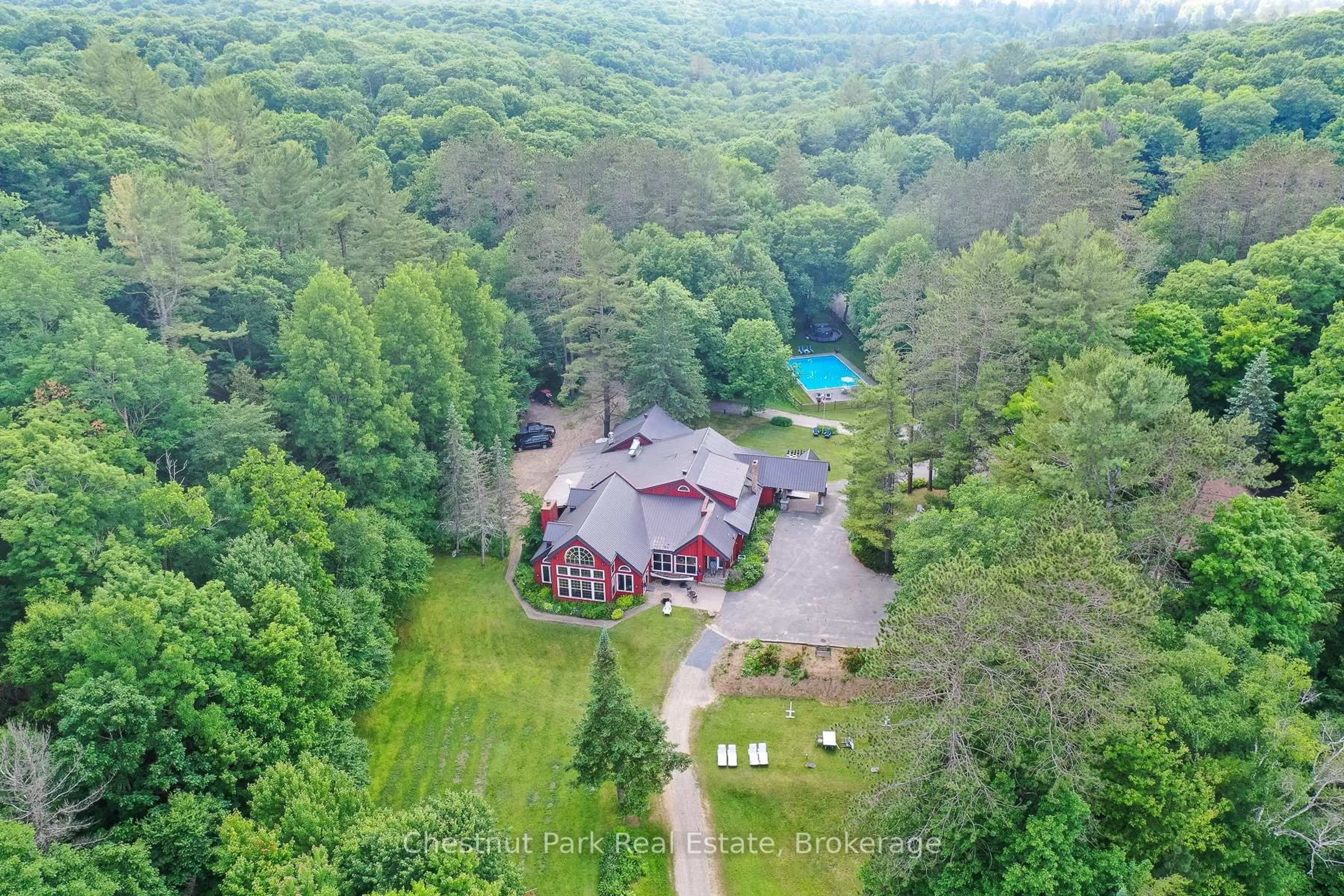 A pic from outside/outdoor area/front of a property/back of a property/a pic from drone, forest/trees view for 848 & 1086 CLEARWATER LAKE Rd & N. Deer Lake Rd, Huntsville Ontario P0B 1L0
