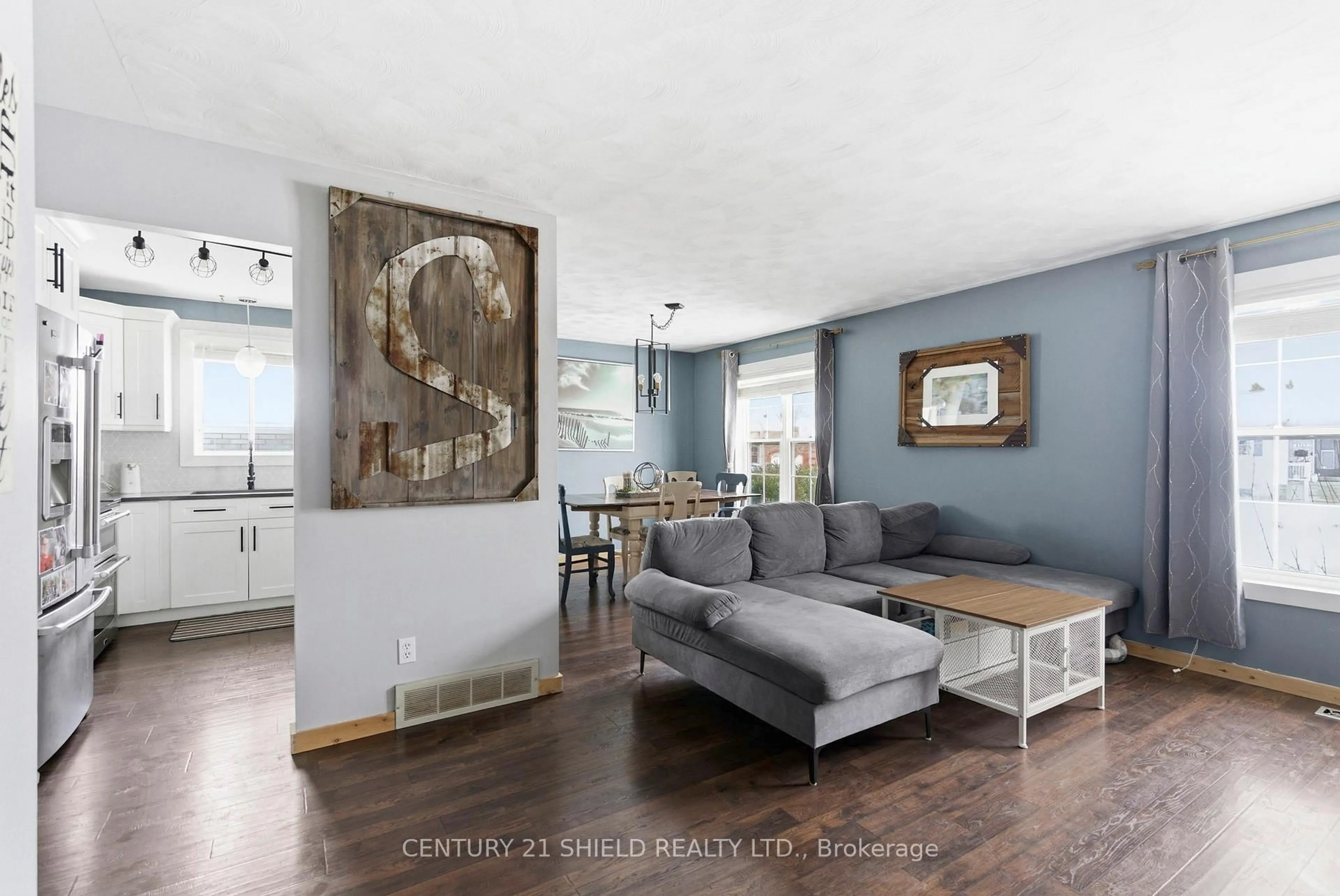 Living room with furniture, wood/laminate floor for 1712 Cumberland St, Cornwall Ontario K6J 5T6