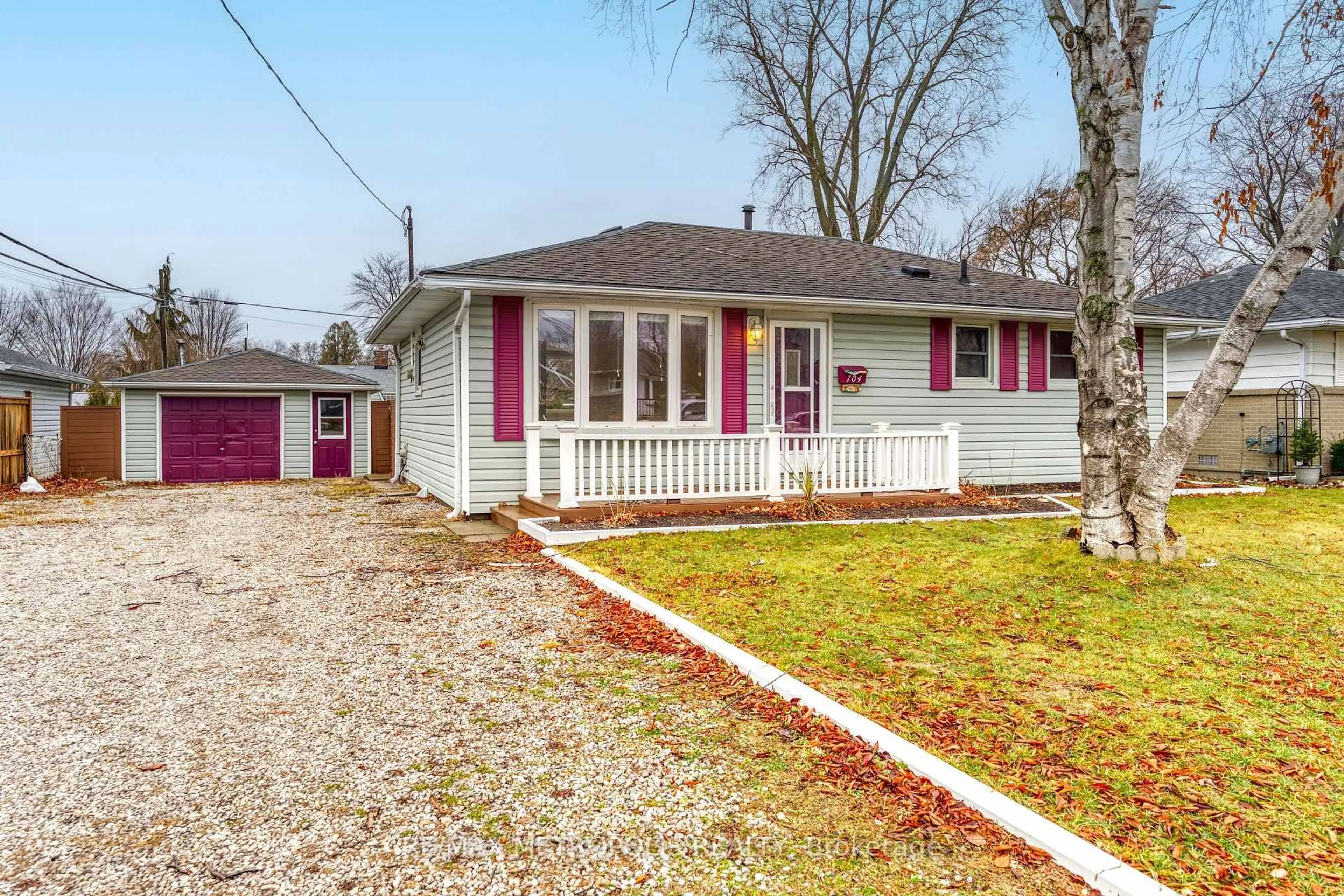 Home with vinyl exterior material, street for 704 Houser St, Point Edward Ontario N7V 1A9