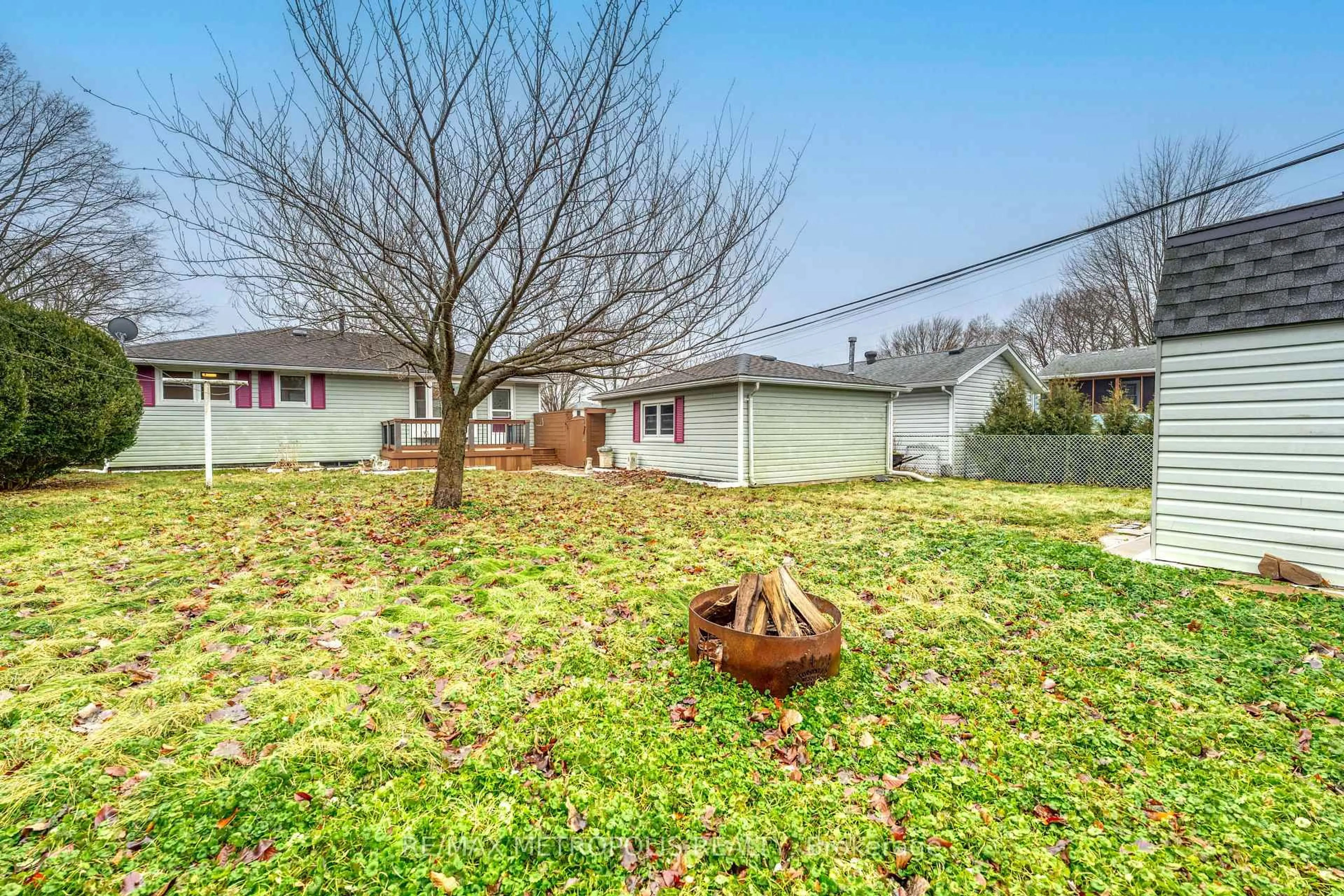 A pic from outside/outdoor area/front of a property/back of a property/a pic from drone, street for 704 Houser St, Point Edward Ontario N7V 1A9