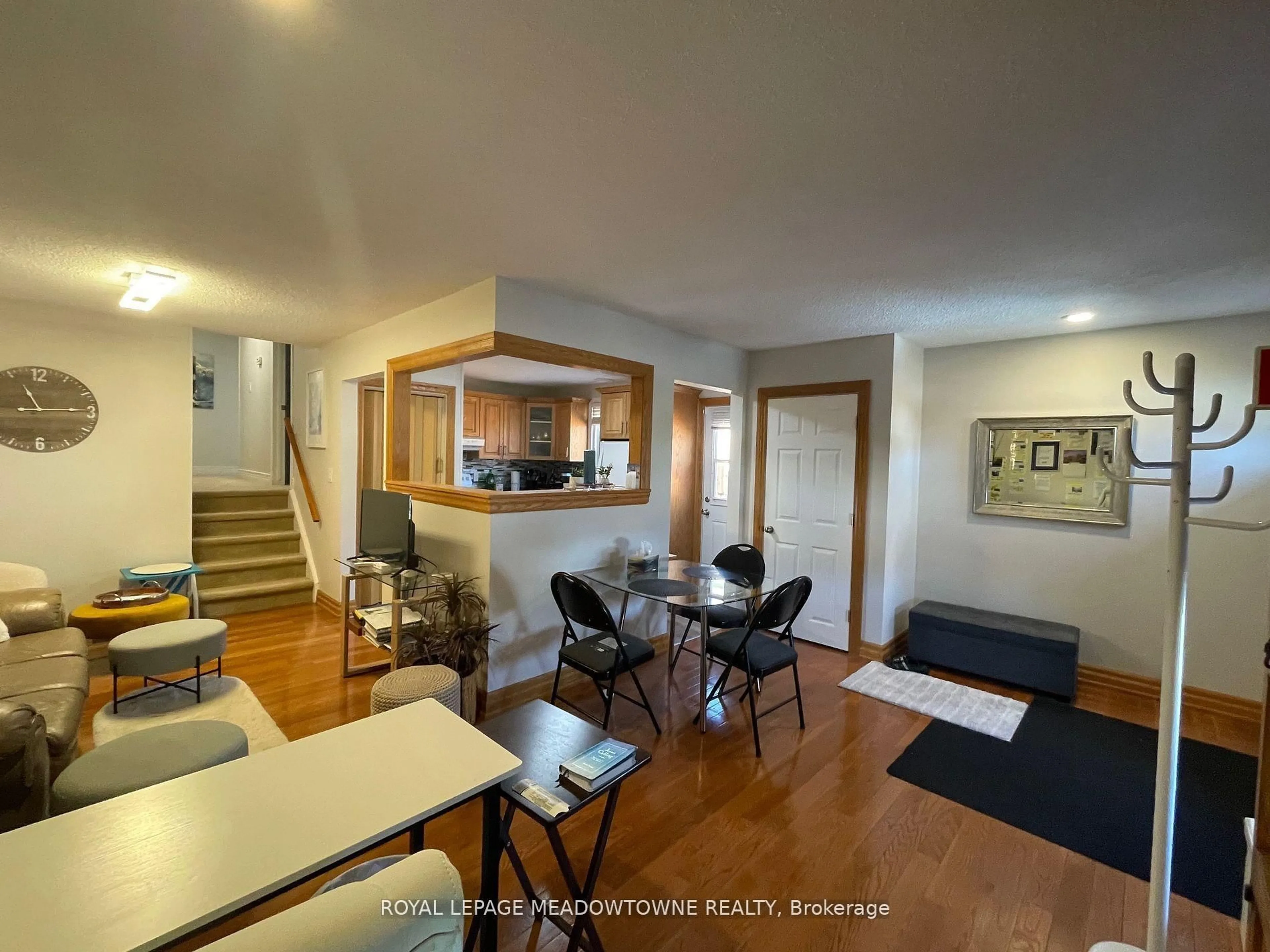 Living room with furniture, wood/laminate floor for 7010 Bonnie St, Niagara Falls Ontario L2G 7L1