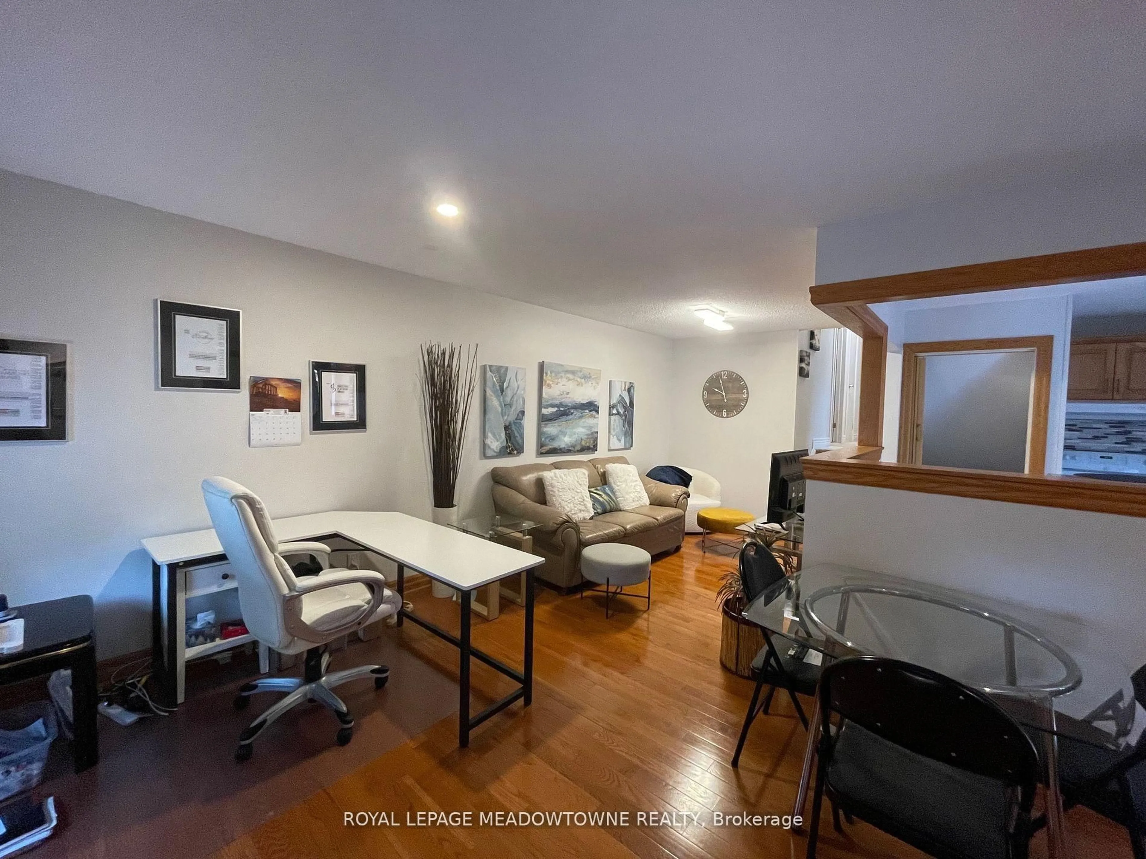 Living room with furniture, wood/laminate floor for 7010 Bonnie St, Niagara Falls Ontario L2G 7L1