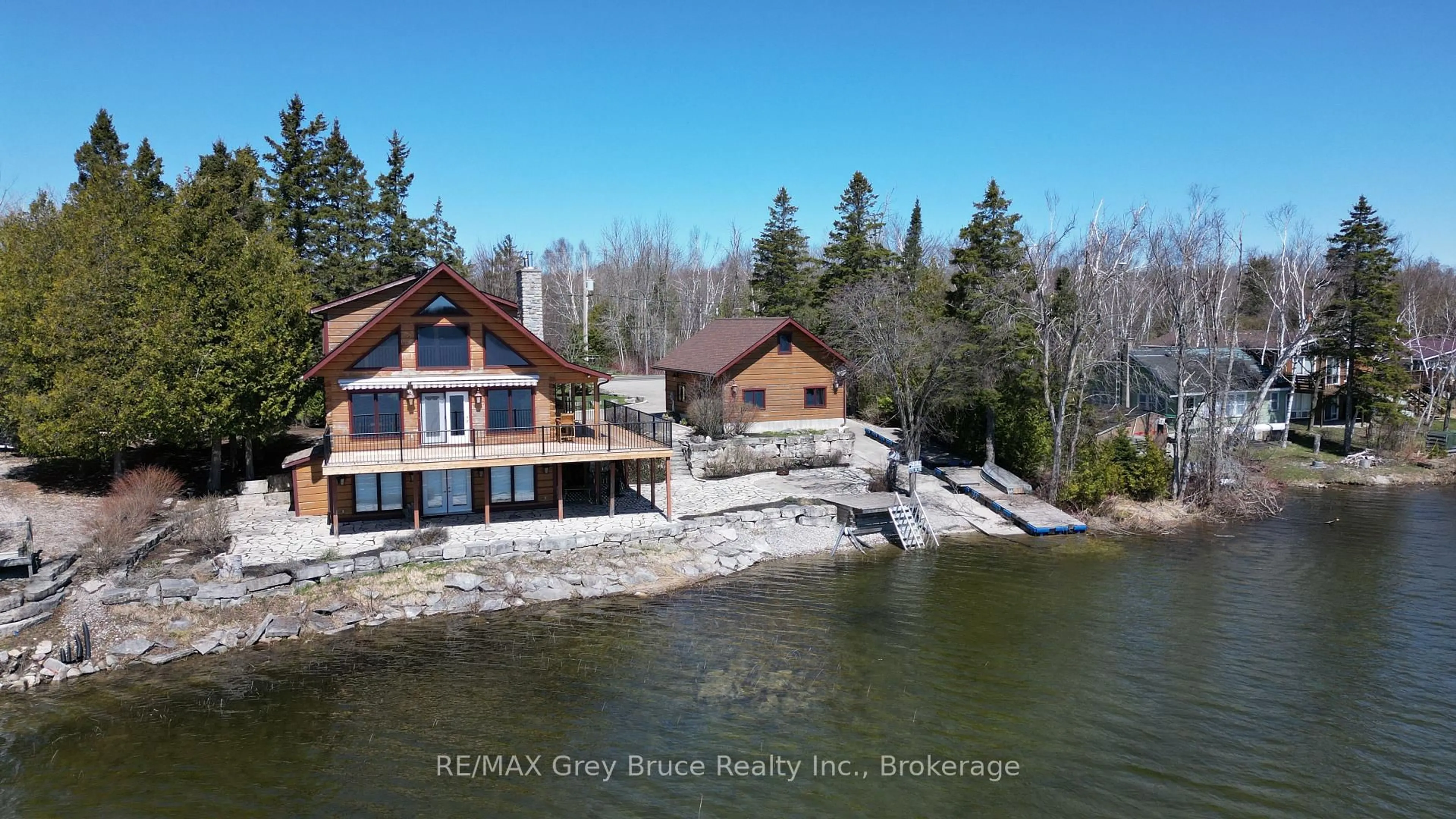 A pic from outside/outdoor area/front of a property/back of a property/a pic from drone, water/lake/river/ocean view for 76 Miller Lake Shore Rd, Northern Bruce Peninsula Ontario N0H 1Z0