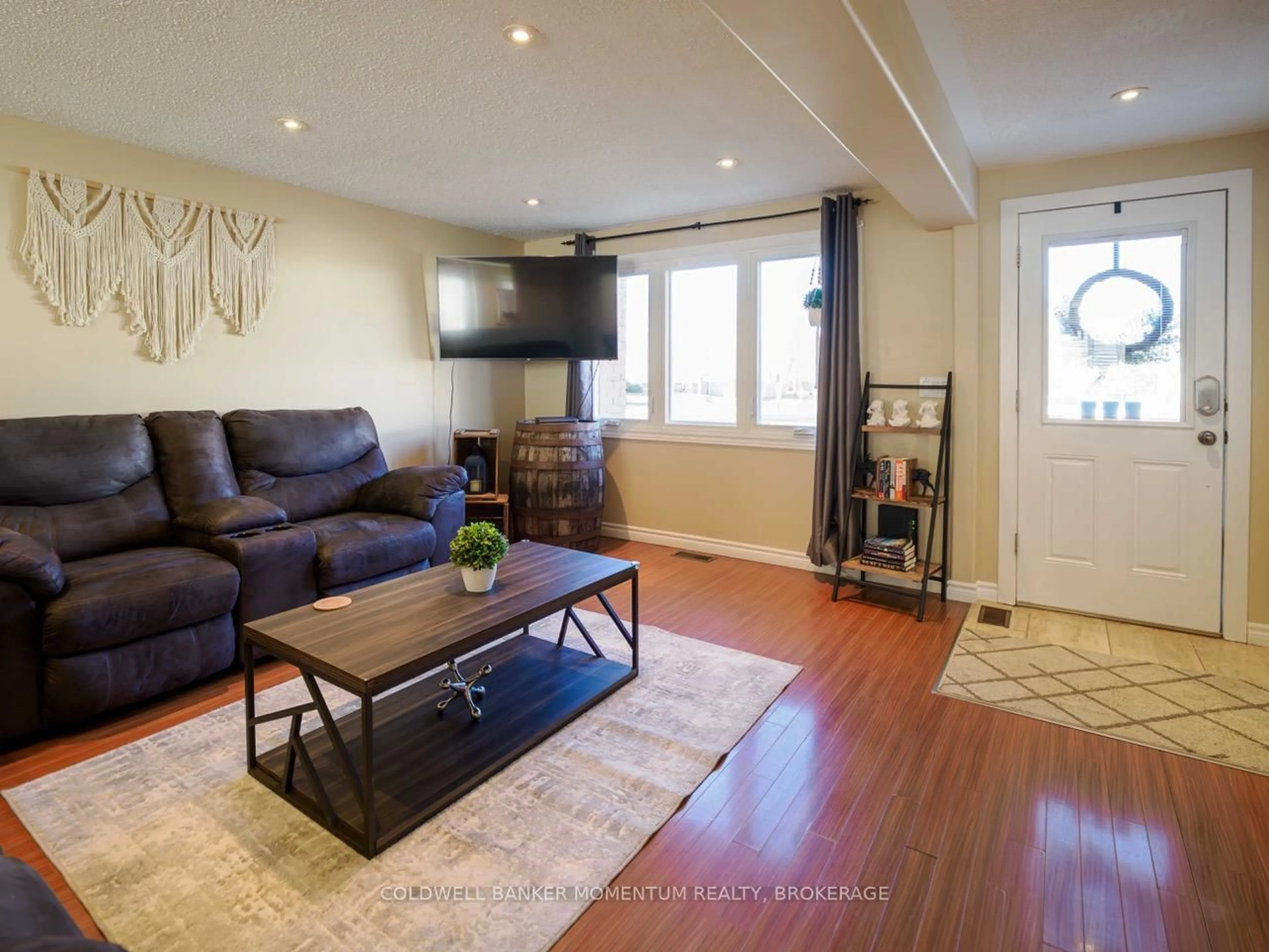 Living room with furniture, wood/laminate floor for 242 Richardson Dr, Norfolk Ontario N0A 1N4