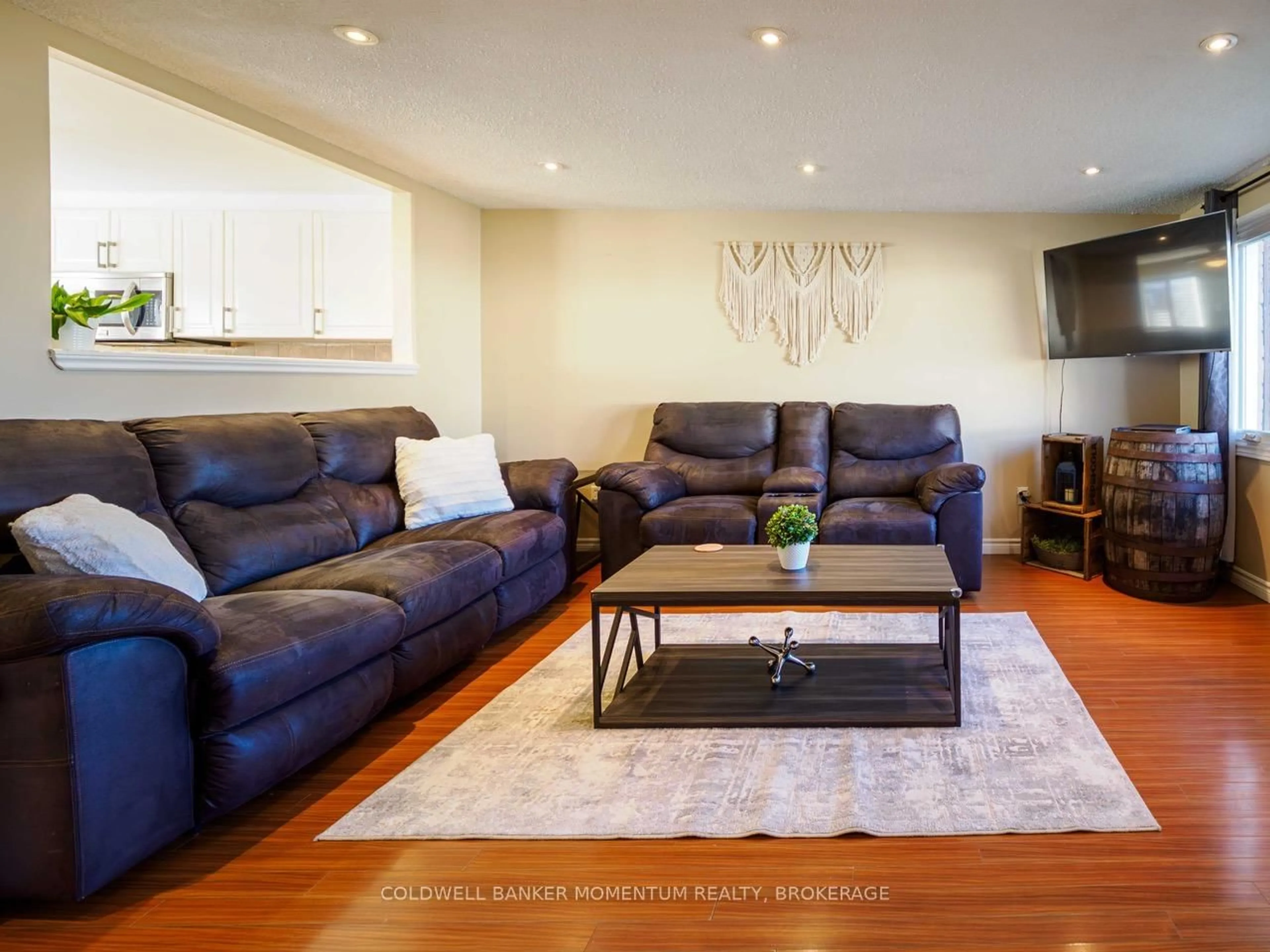 Living room with furniture, wood/laminate floor for 242 Richardson Dr, Norfolk Ontario N0A 1N4