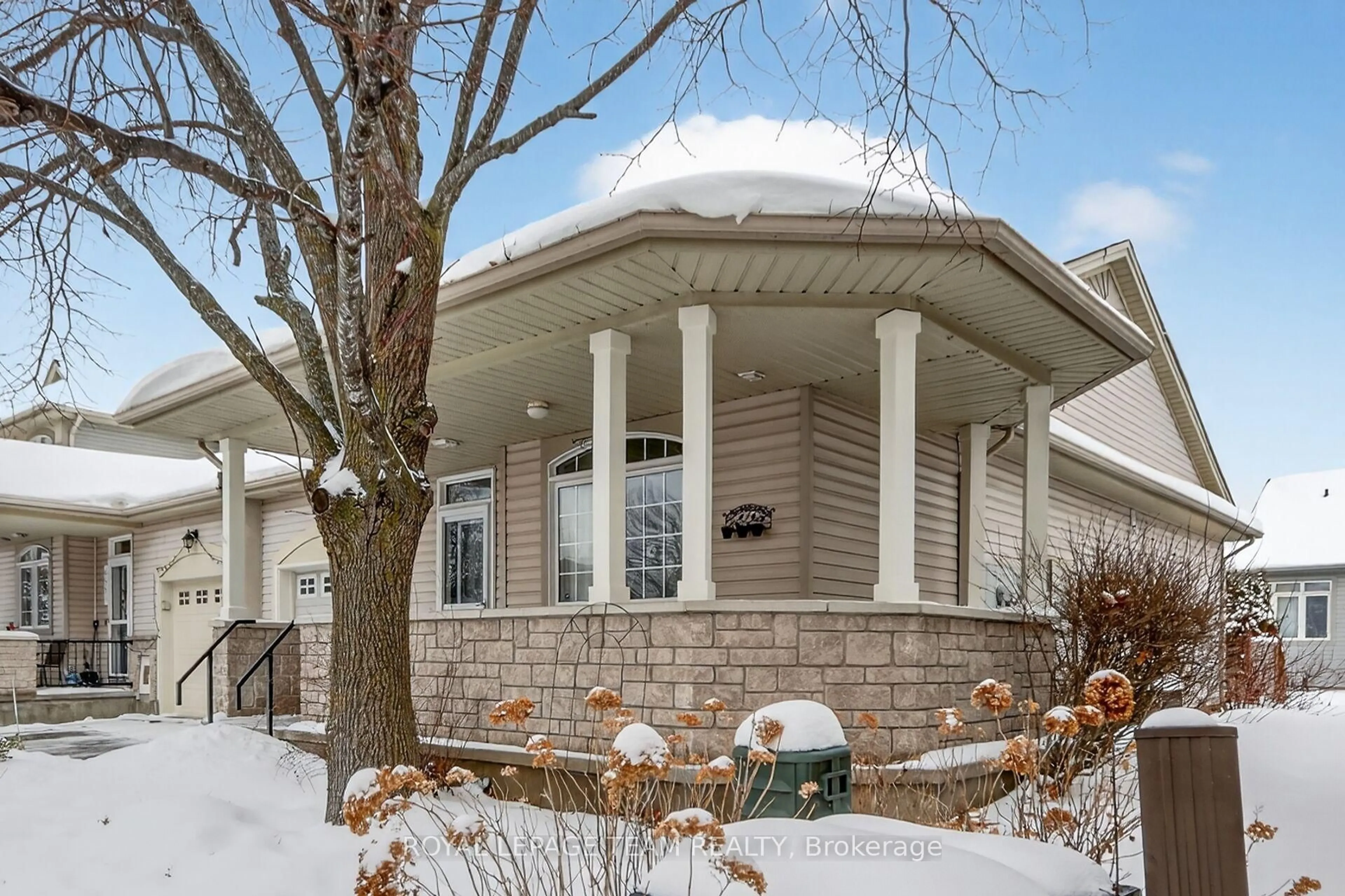 Home with vinyl exterior material, street for 5553 Doctor Leach Dr, Ottawa Ontario K4M 1L6