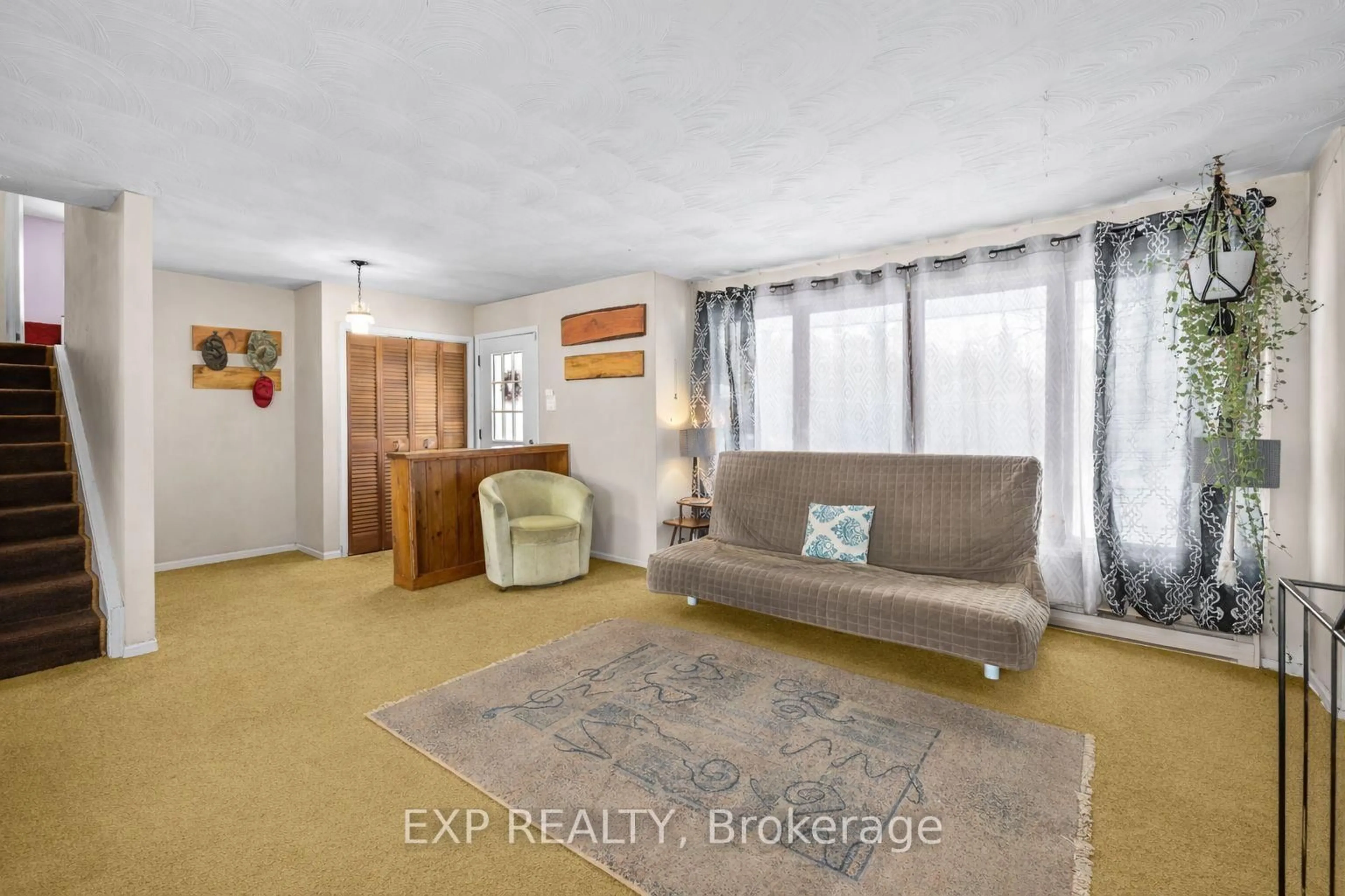 Living room with furniture, carpet floor for 3746 campbellcroft Rd, Osgoode Ontario K0A 2W0