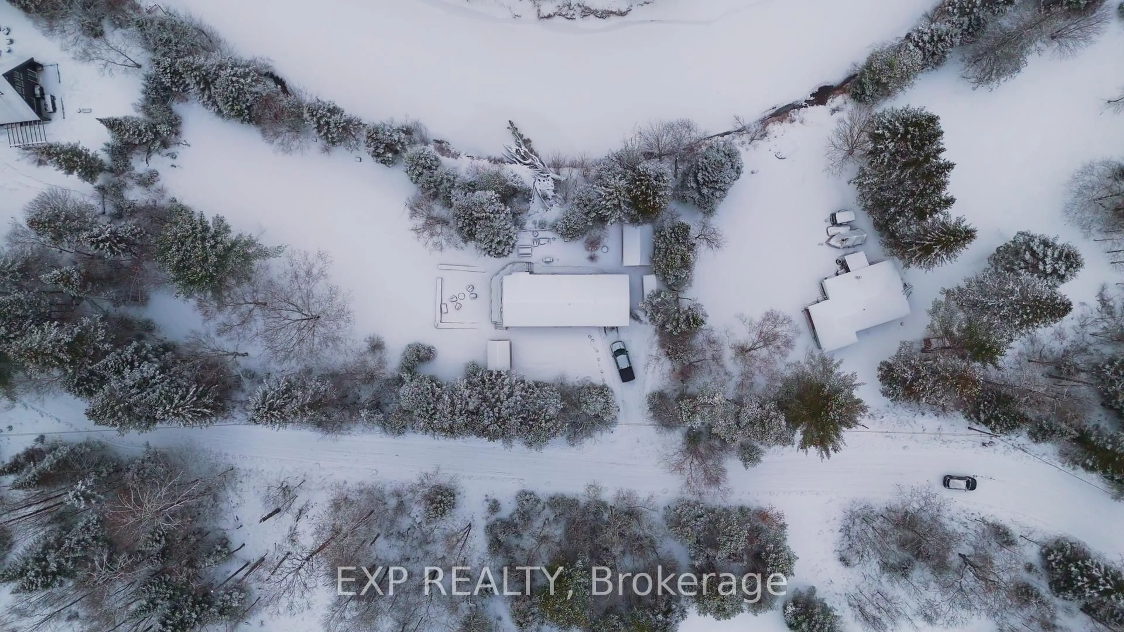 A pic from outside/outdoor area/front of a property/back of a property/a pic from drone, street for 27 Groeger Rd, Huntsville Ontario P1H 2J4