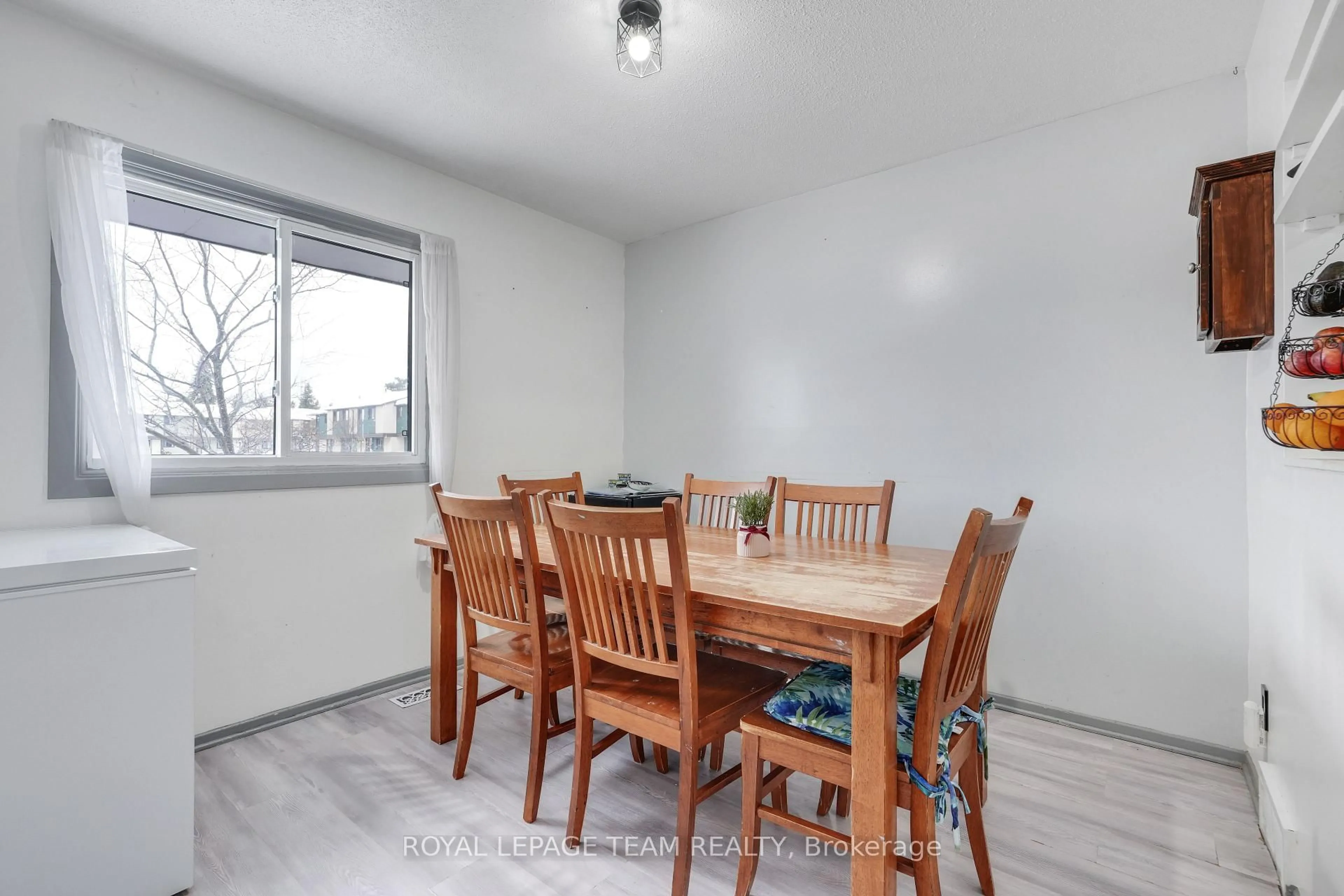 Dining room, wood/laminate floor for 1807 Meadowbrook Rd, Ottawa Ontario K1B 4W6