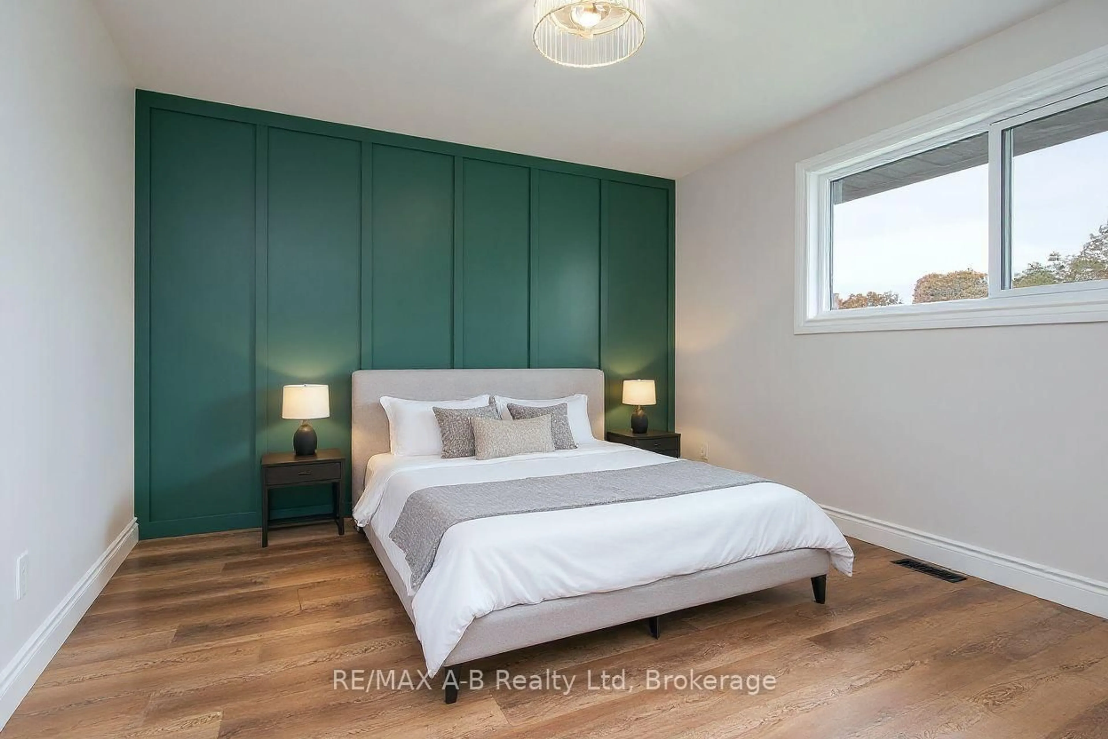 Bedroom with bed, wood/laminate floor for 149 Norfolk St, Stratford Ontario N5A 3Y7