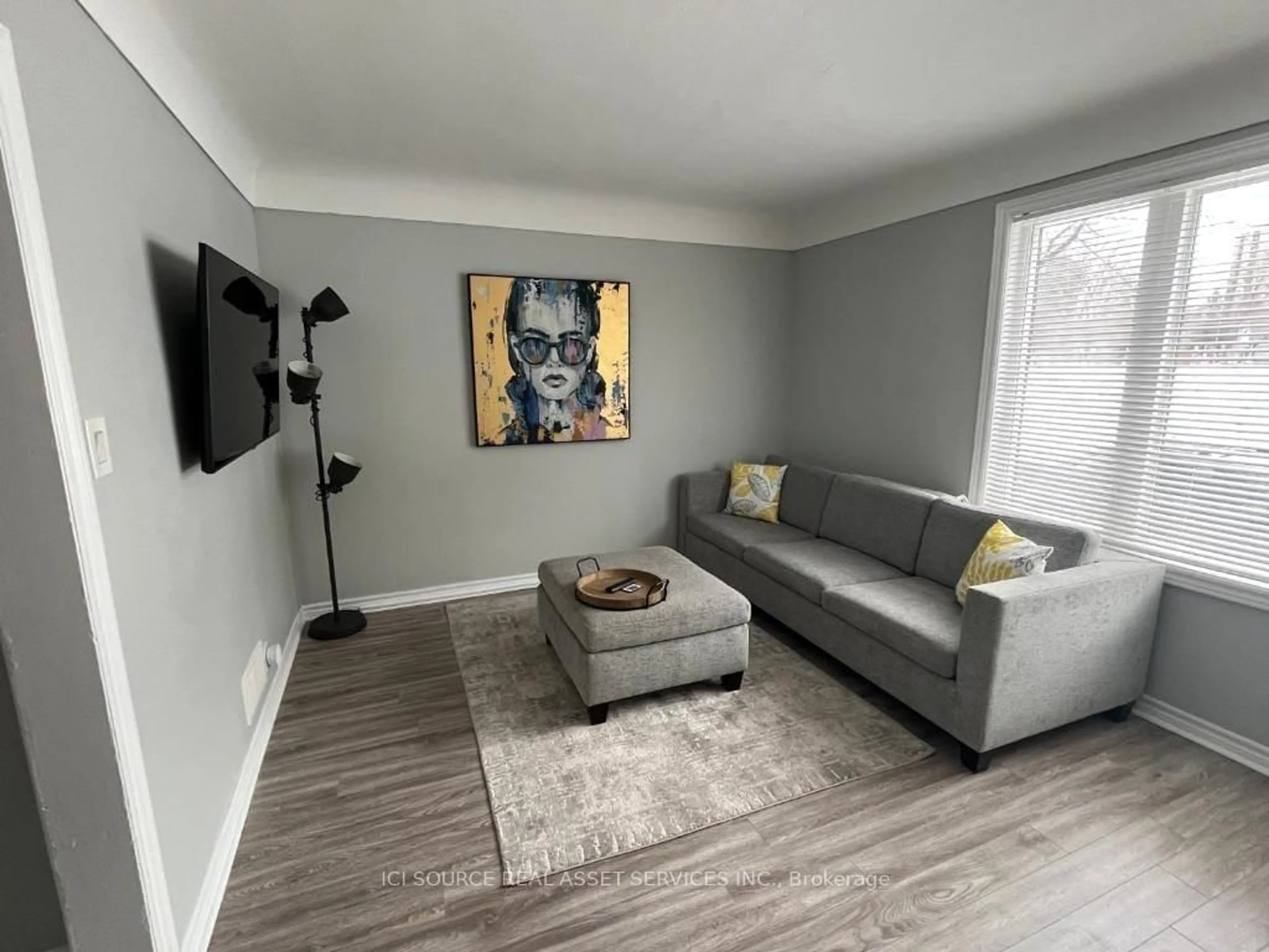 Living room with furniture, wood/laminate floor for 200 Cantin St, Ottawa Ontario K1L 6T1