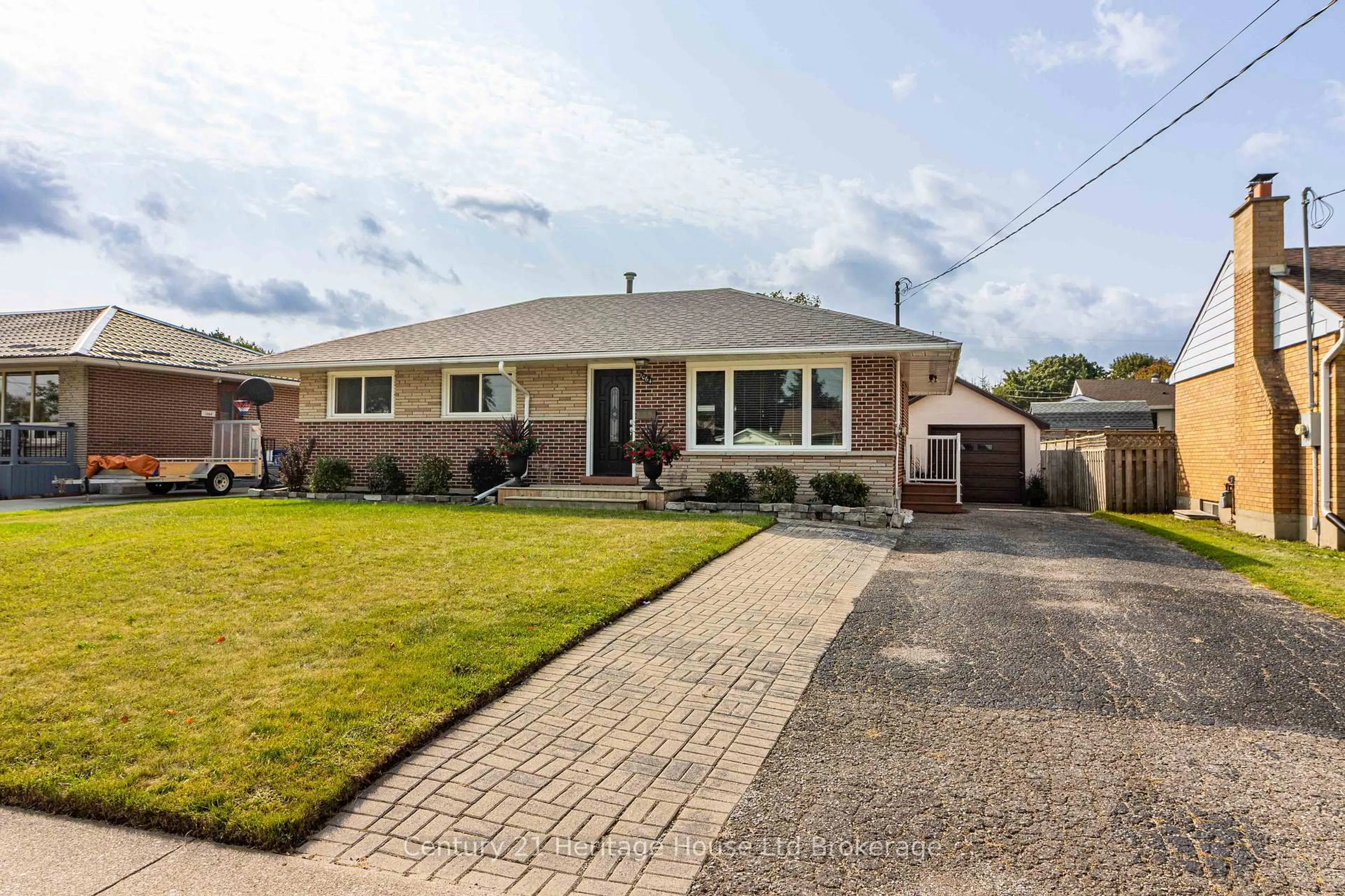 Home with brick exterior material, street for 1064 Sovereign Rd, Woodstock Ontario N4S 5P2