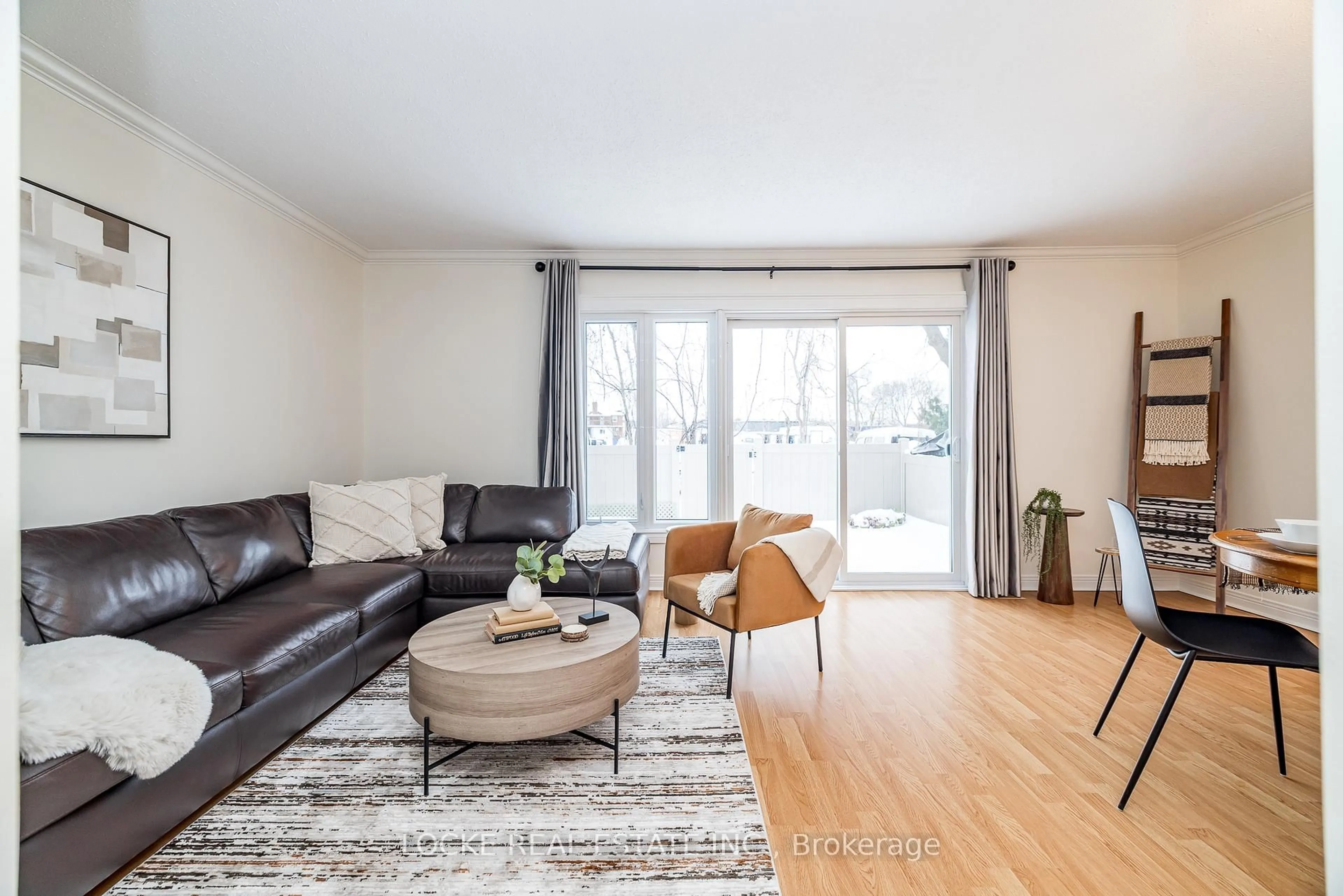 Living room with furniture, wood/laminate floor for 550 Straby Ave #22, Ottawa Ontario K1K 1H1