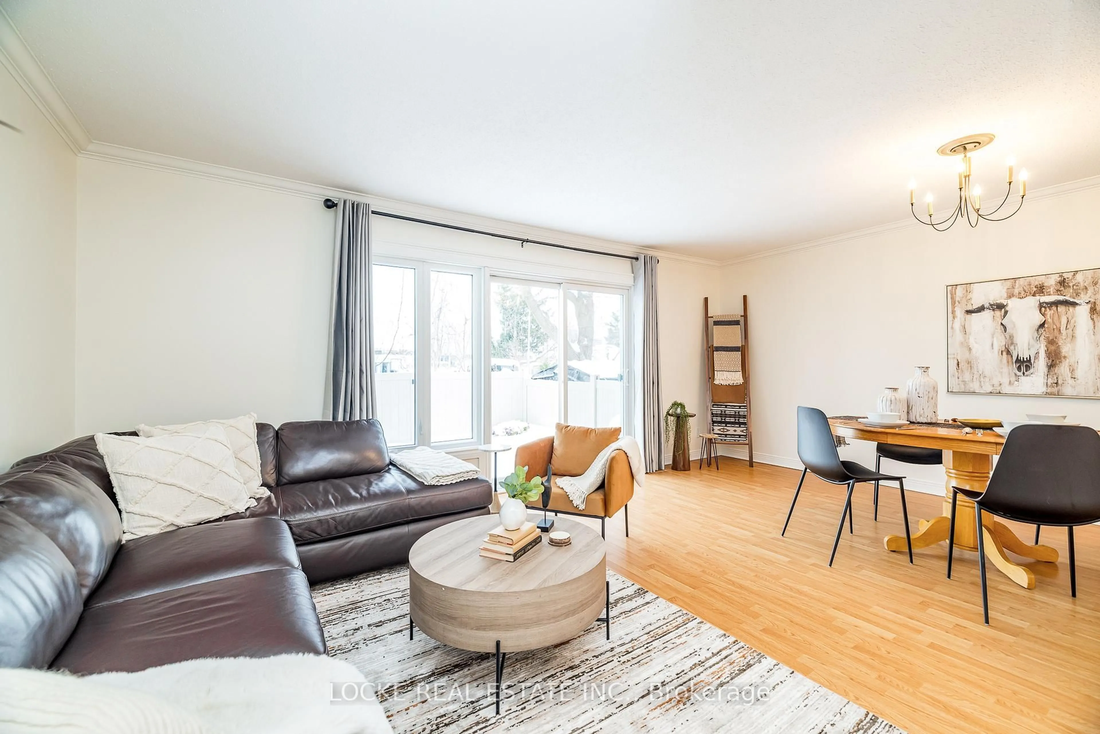 Living room with furniture, wood/laminate floor for 550 Straby Ave #22, Ottawa Ontario K1K 1H1