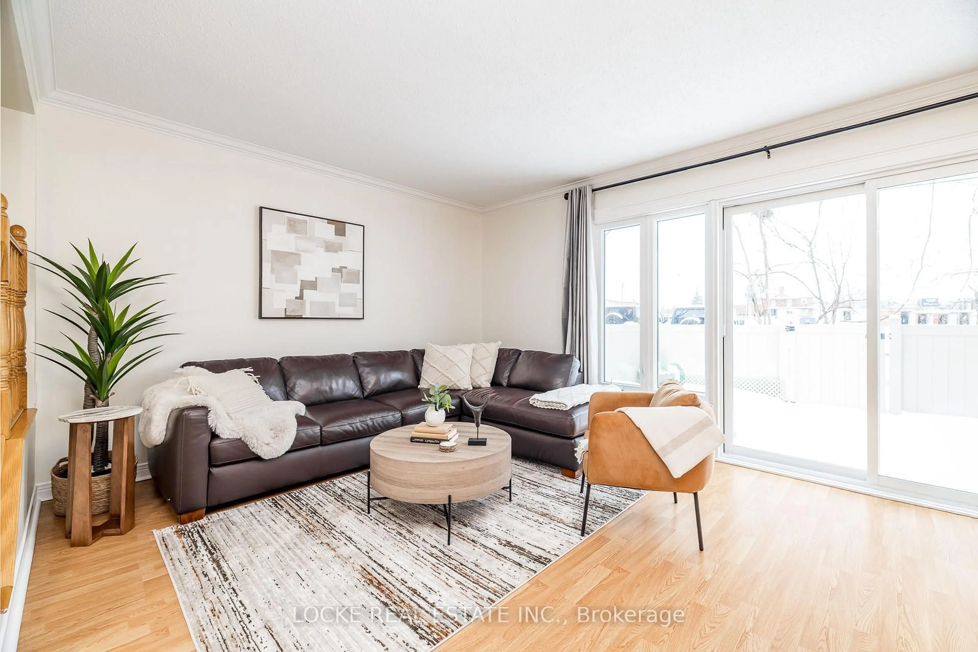 Living room with furniture, wood/laminate floor for 550 Straby Ave #22, Ottawa Ontario K1K 1H1