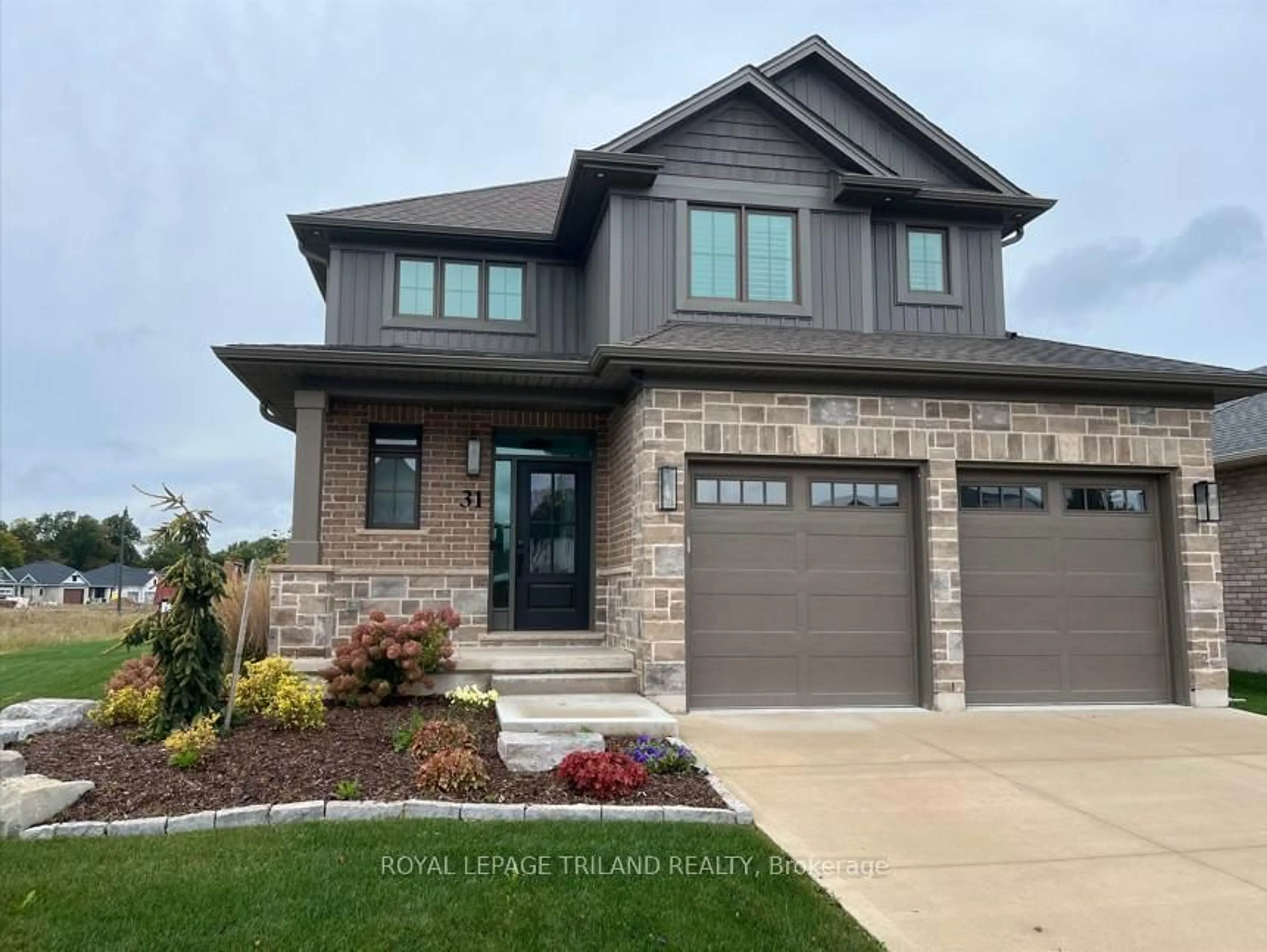 Home with brick exterior material, street for 31 SNOWY OWL Tr, Central Elgin Ontario N5R 0M6