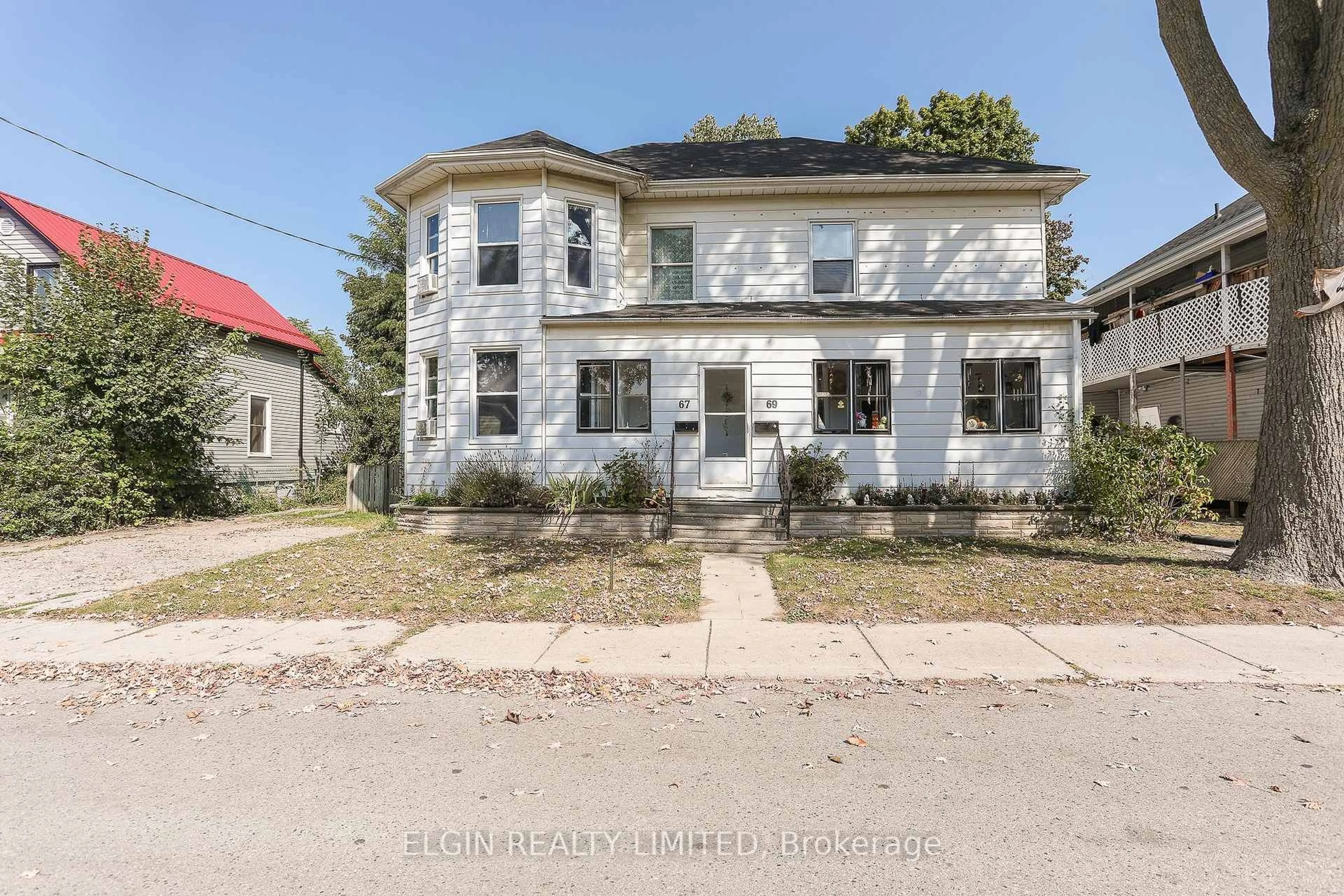 Home with brick exterior material, street for 67-69 Elizabeth St, St. Thomas Ontario N5R 2X3