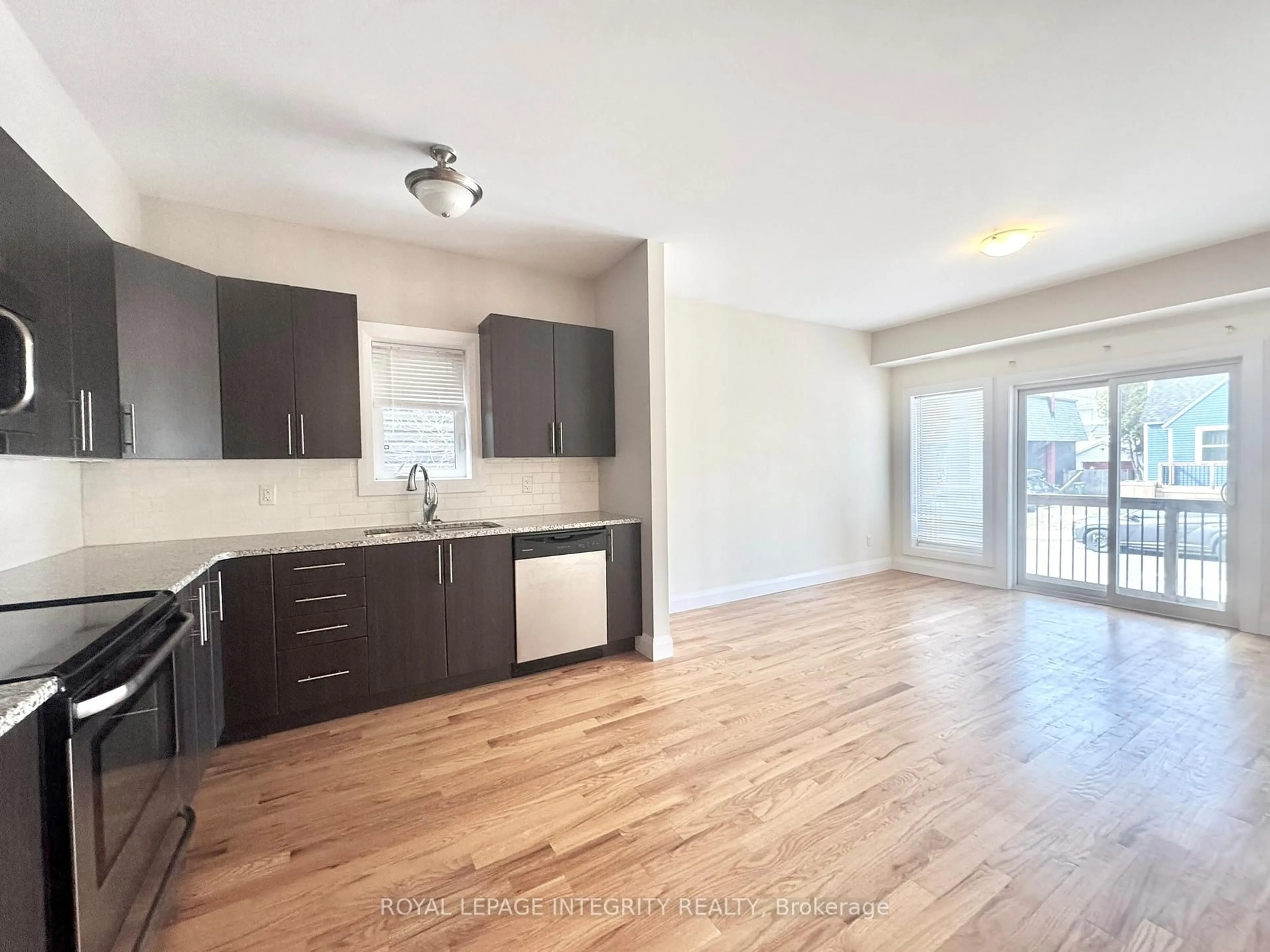 Open concept kitchen, wood/laminate floor for 138 King George St, Ottawa Ontario K1K 1V3