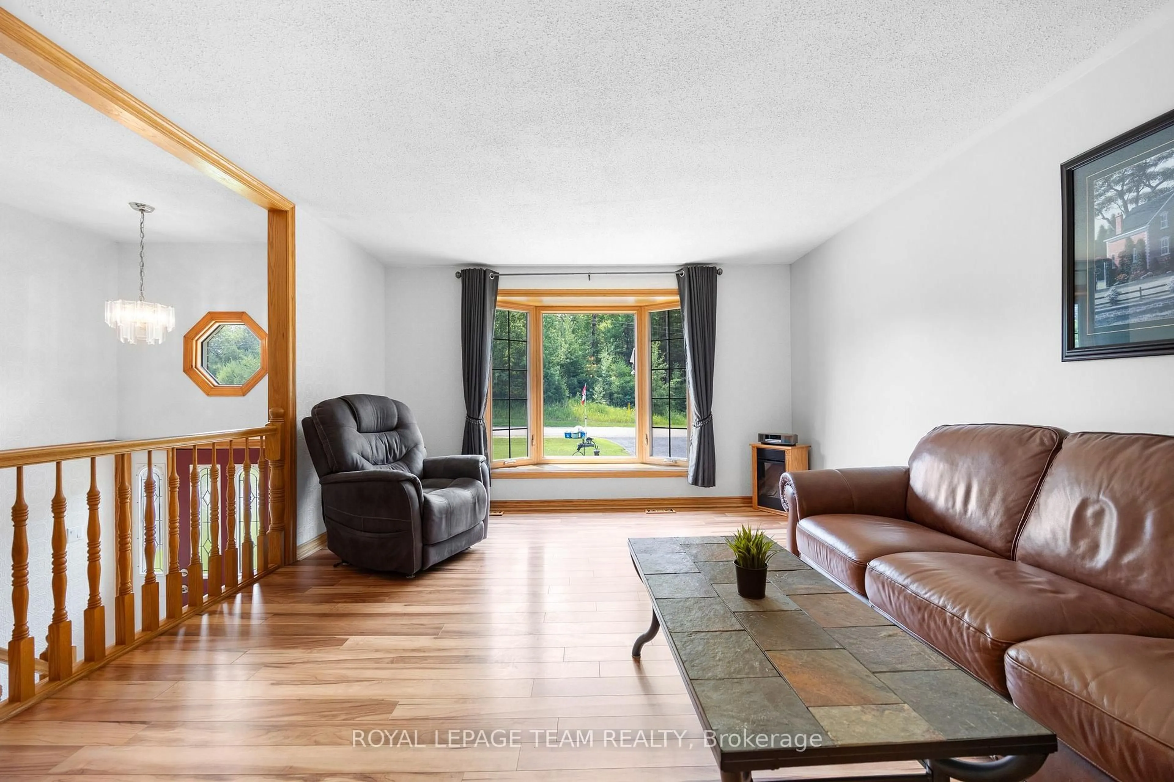 Living room with furniture, wood/laminate floor for 3700 Cedar Grove Rd, Edwardsburgh/Cardinal Ontario K0E 1T1